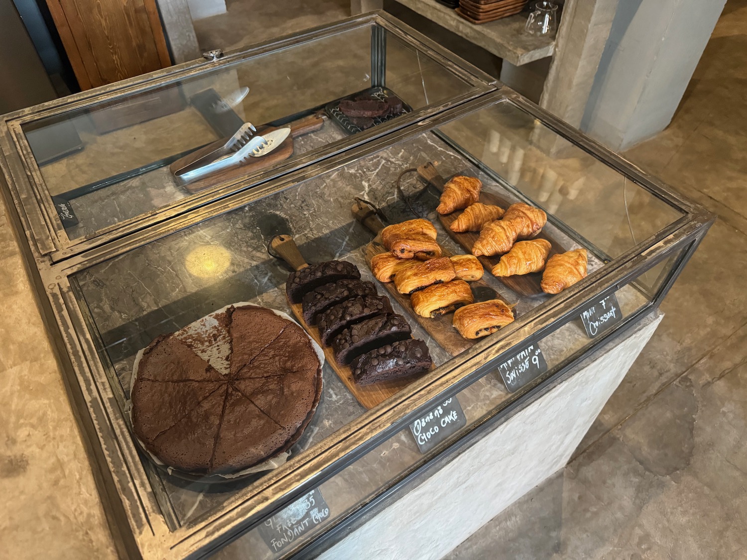 a glass case with pastries and pastries on it