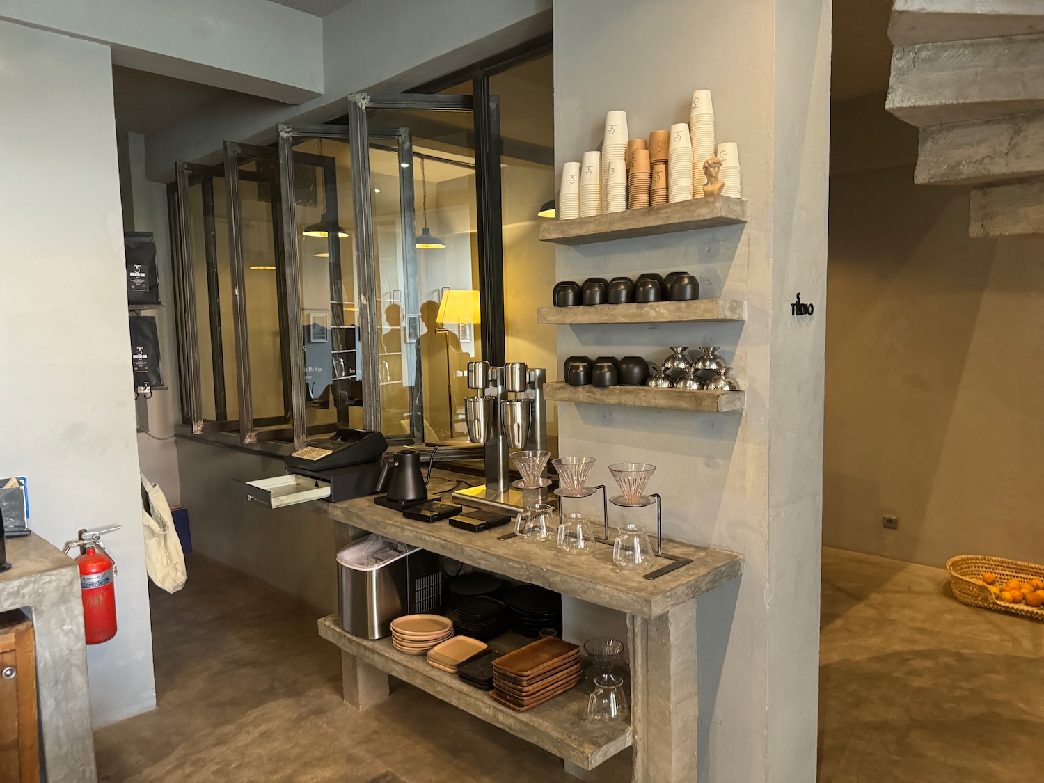 a room with a wall and shelves