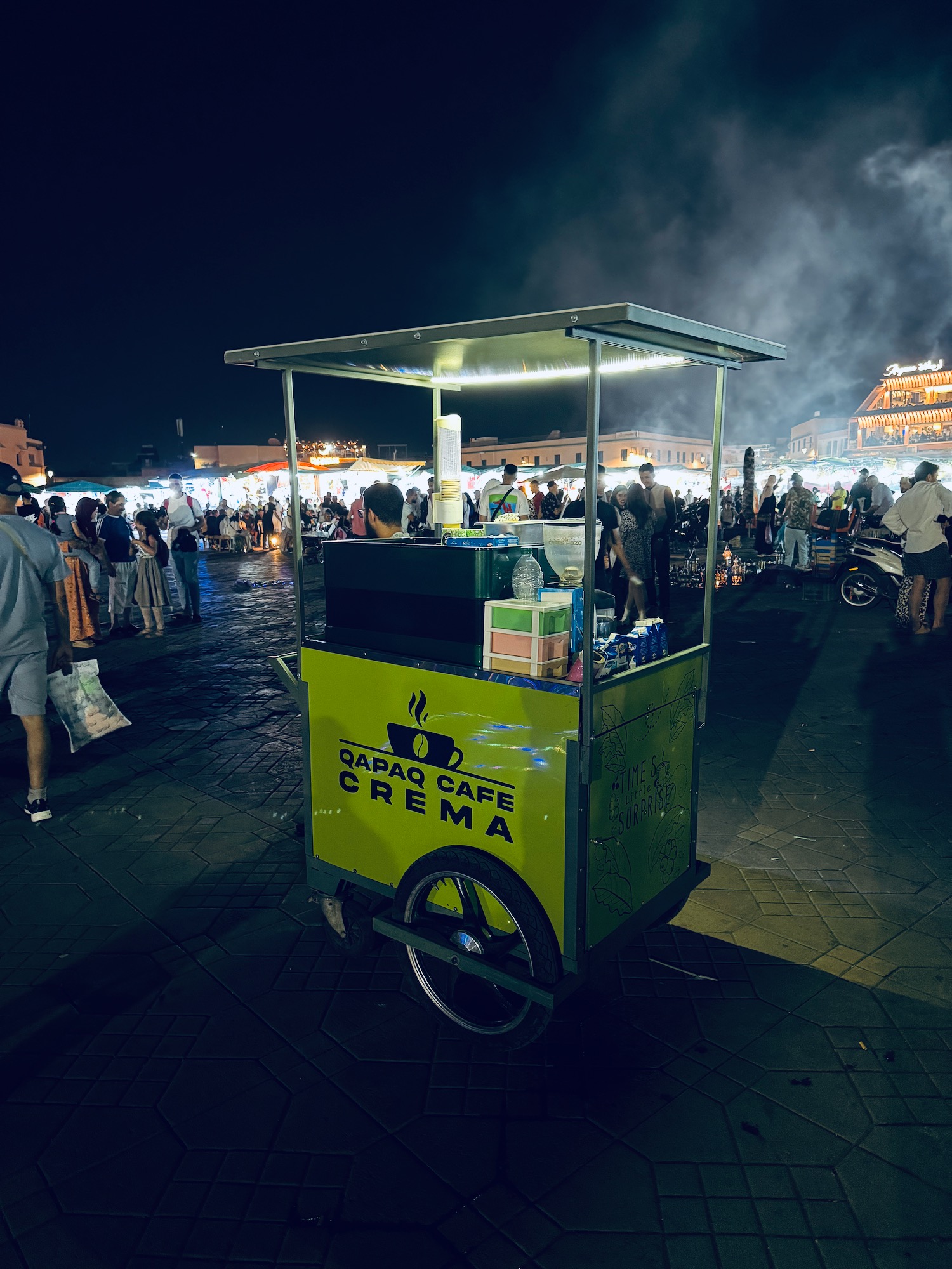 a food cart with people around it