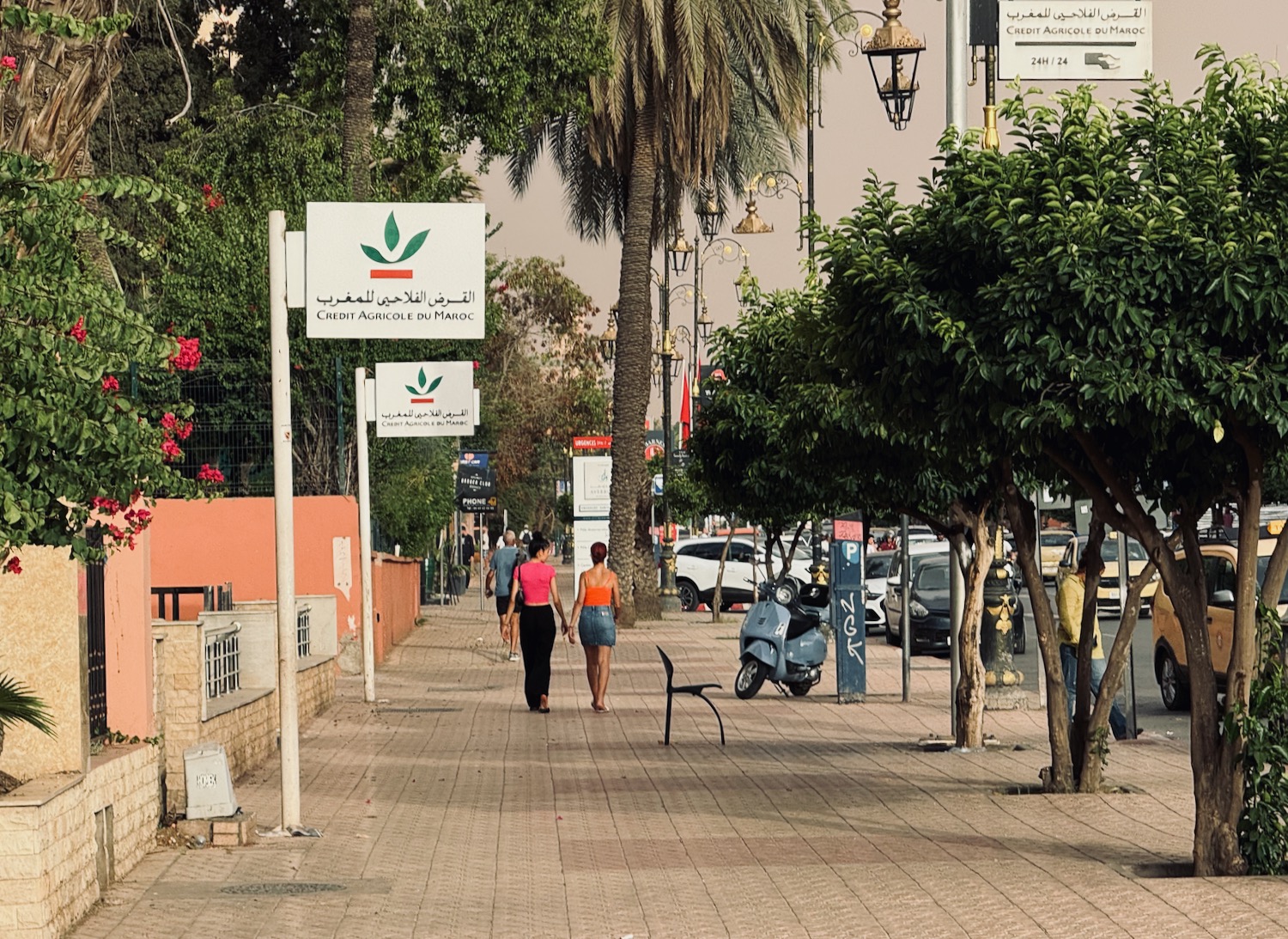 people walking on a sidewalk