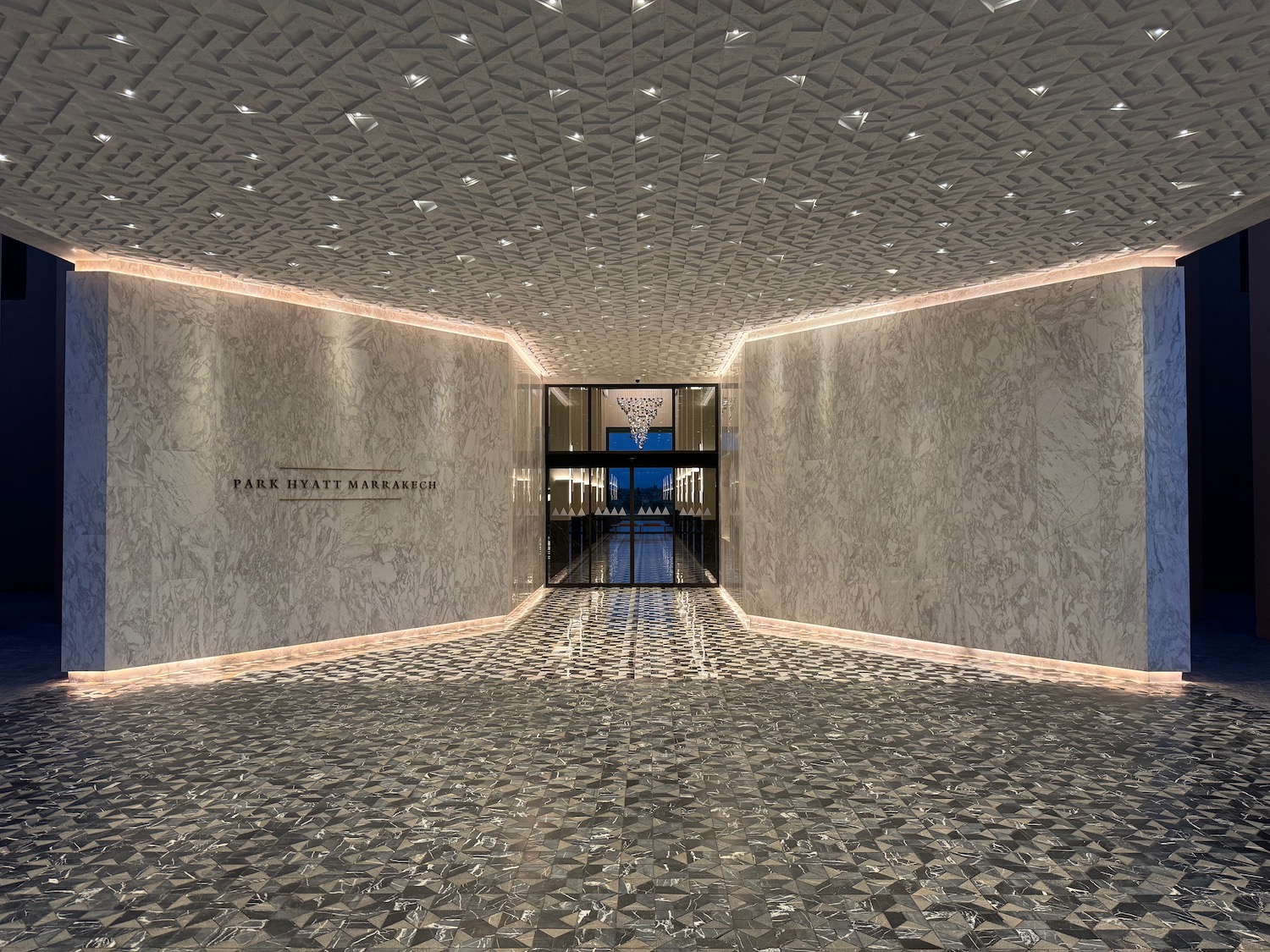 a hallway with a glass door