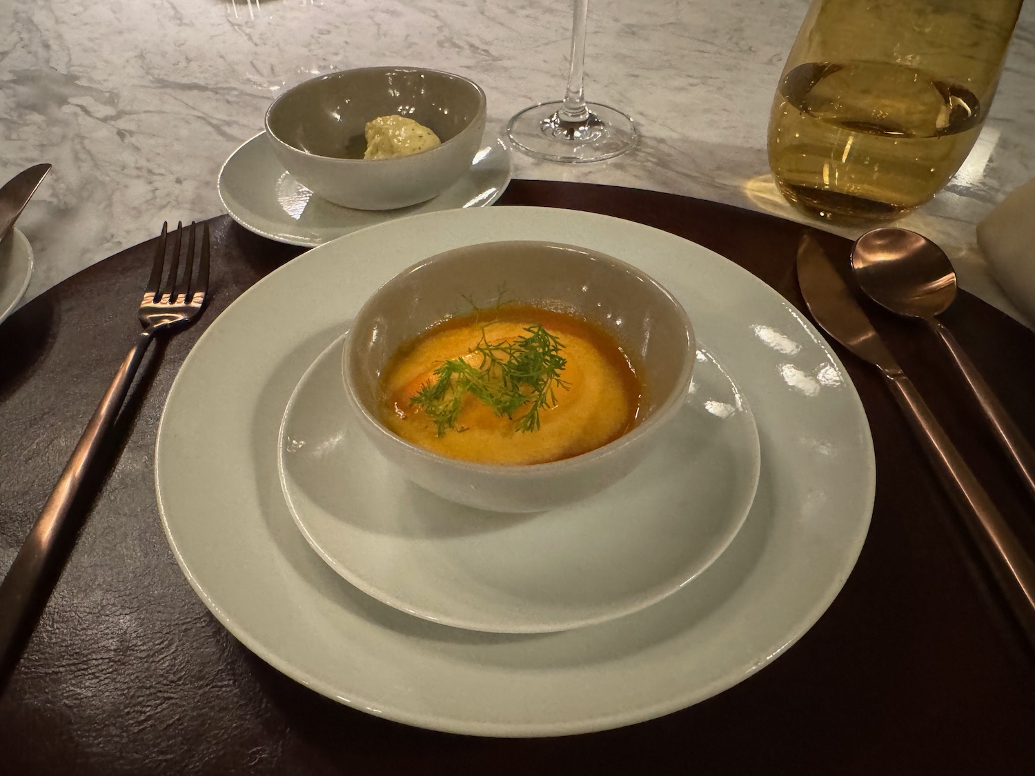 a bowl of soup on a plate