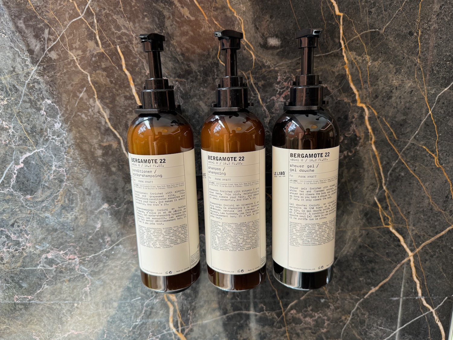 a group of bottles on a marble surface