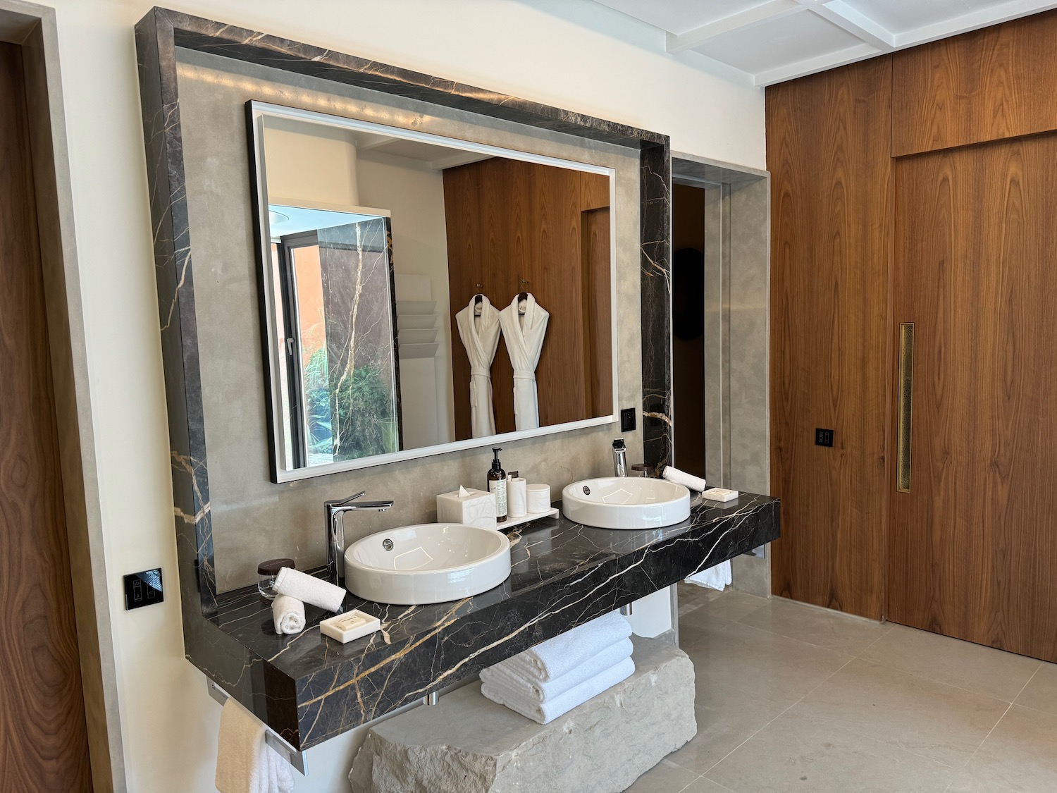 a bathroom with a large mirror and sinks