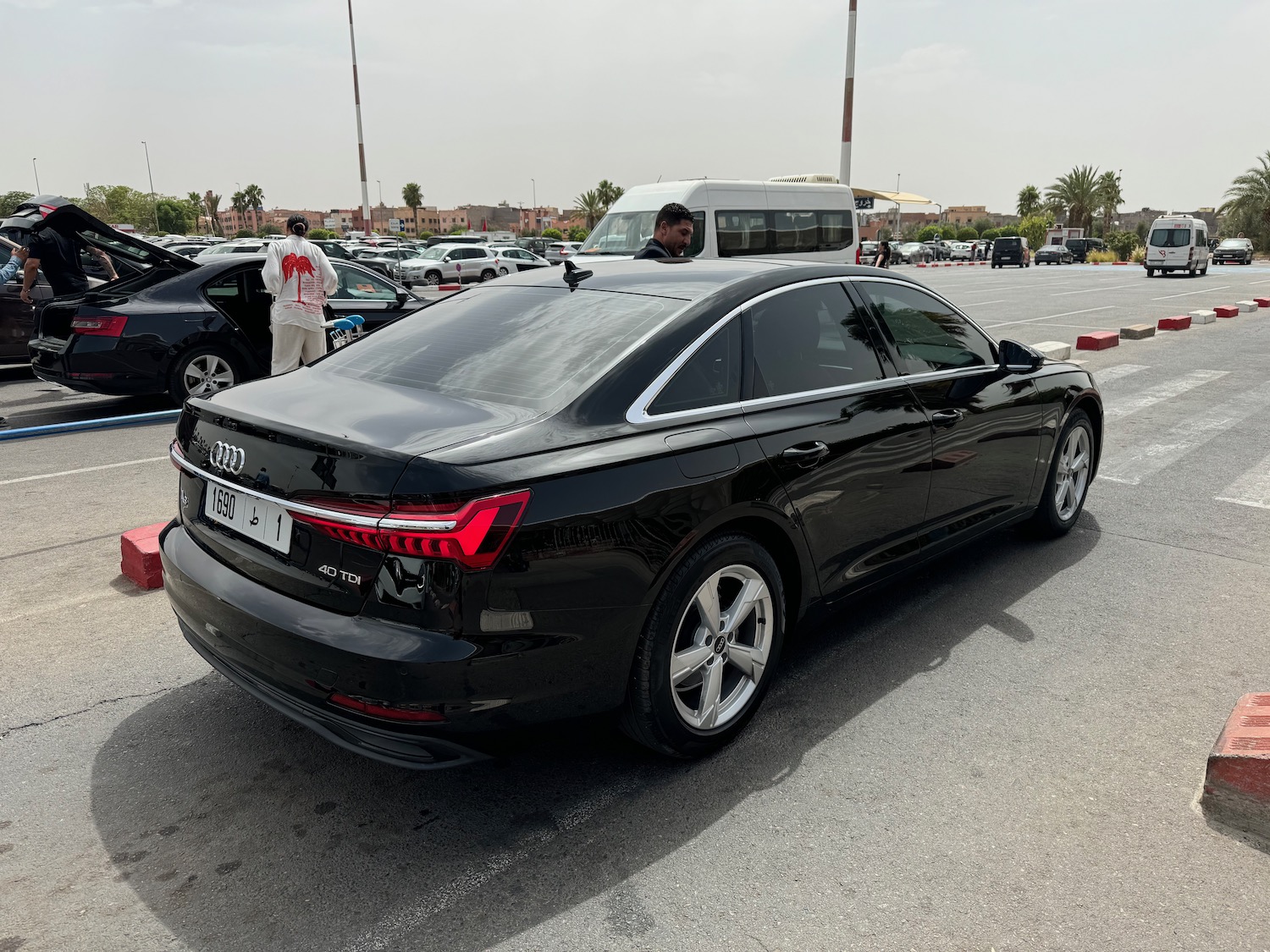 a black car parked in a parking lot
