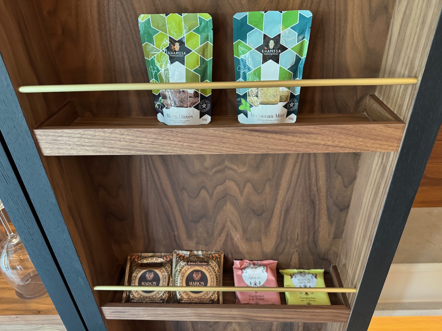 a shelf with a variety of condiments