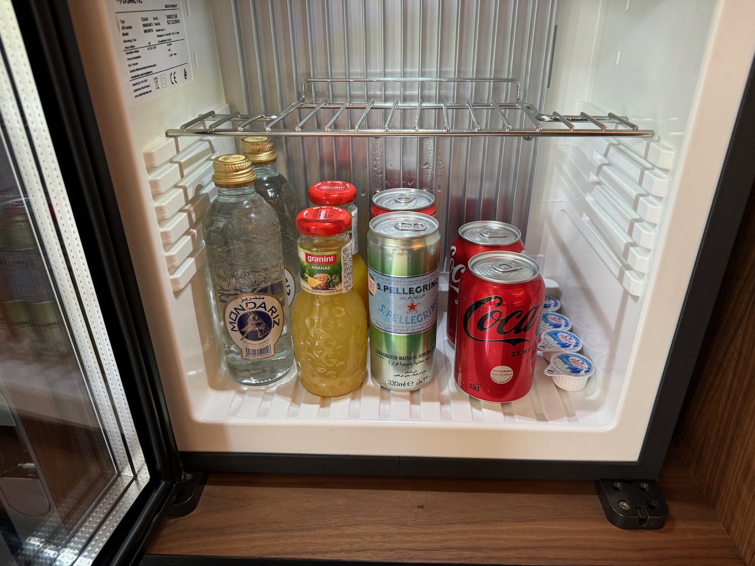 a mini fridge full of drinks