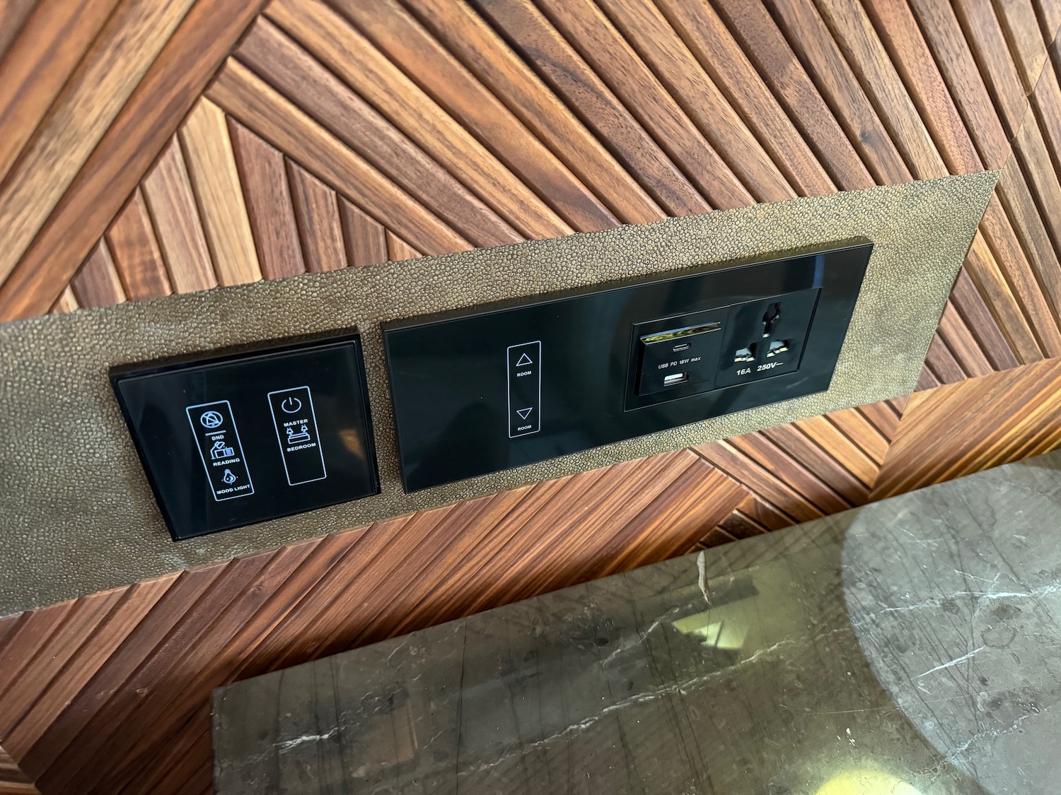a black rectangular switches on a wall