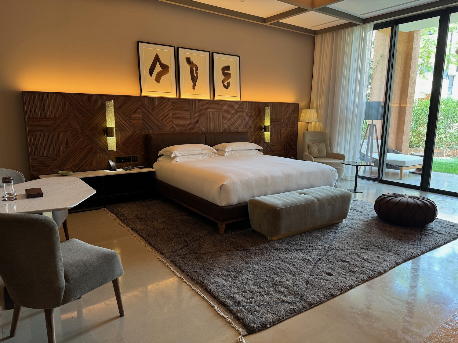 a bedroom with a bed and a table