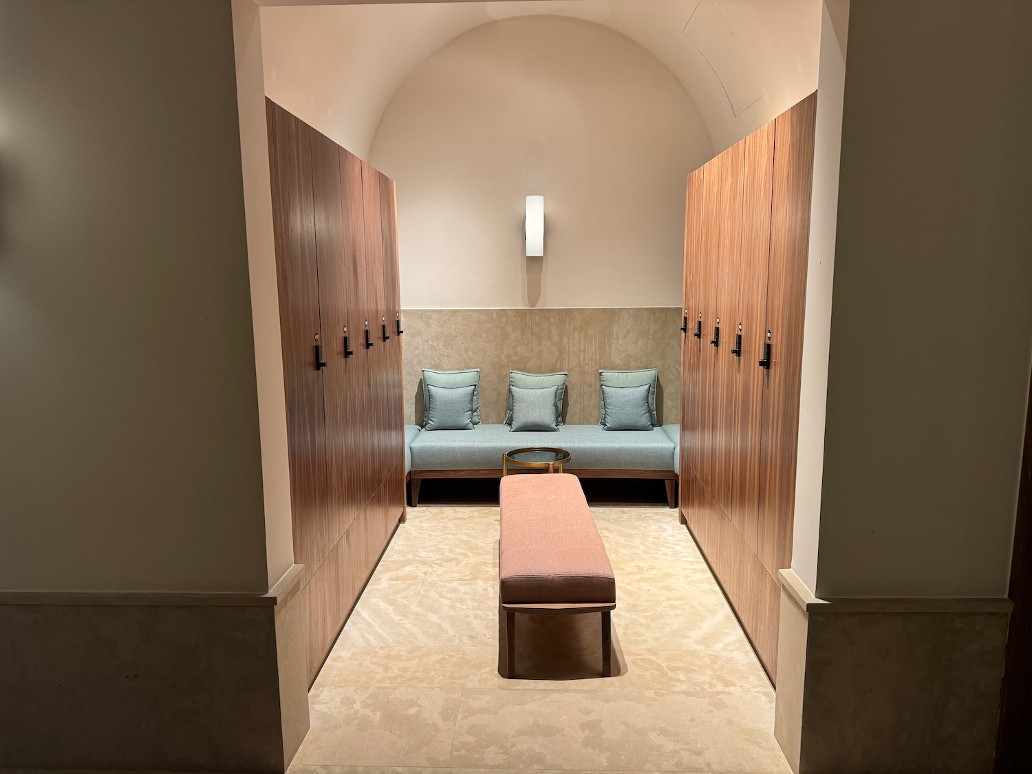 a locker room with a bench and lockers