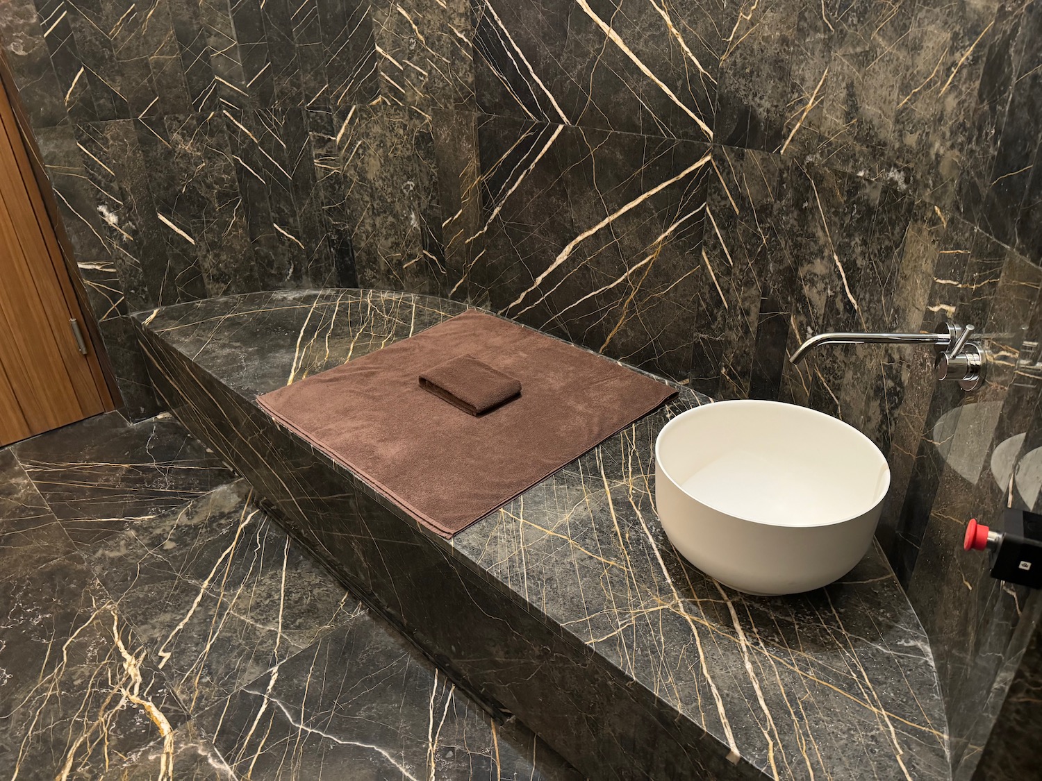 a sink and towel on a counter