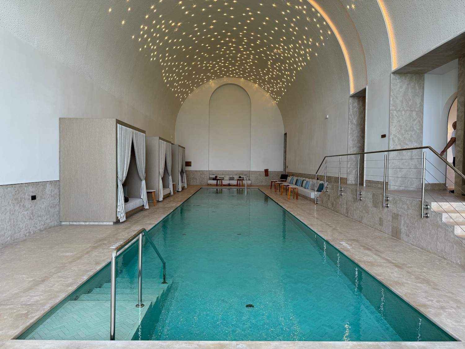 a indoor pool with a staircase and a staircase