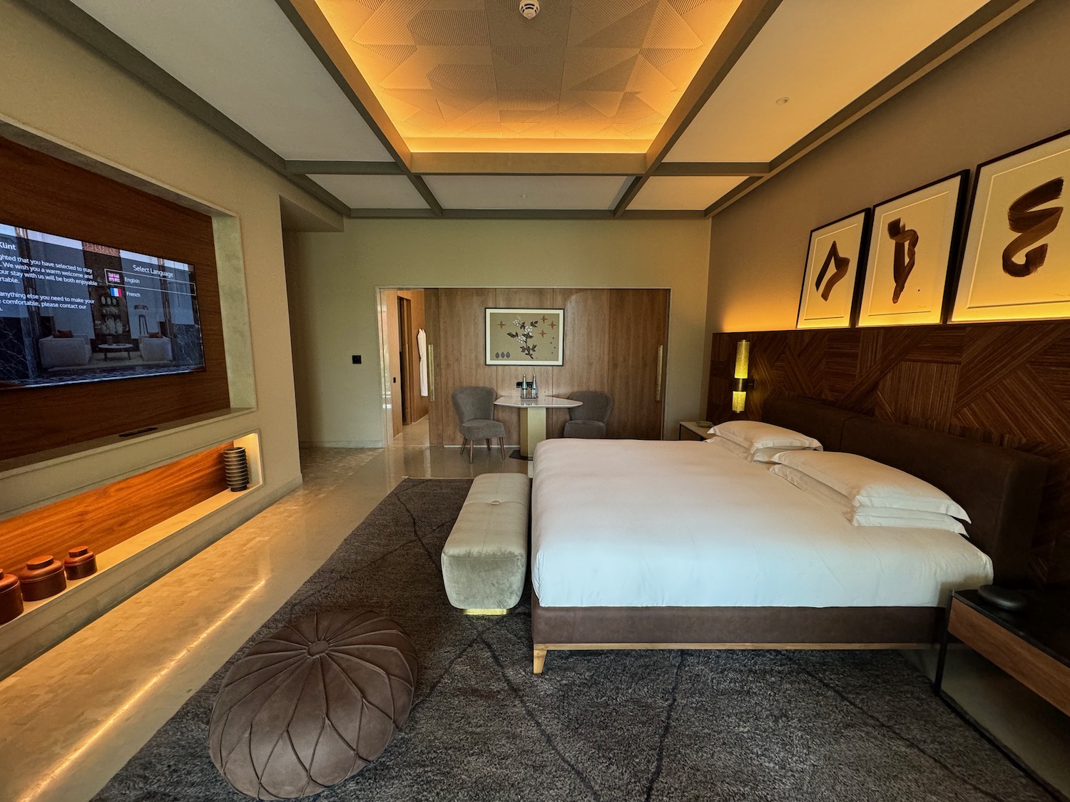 a room with a bed and a tv