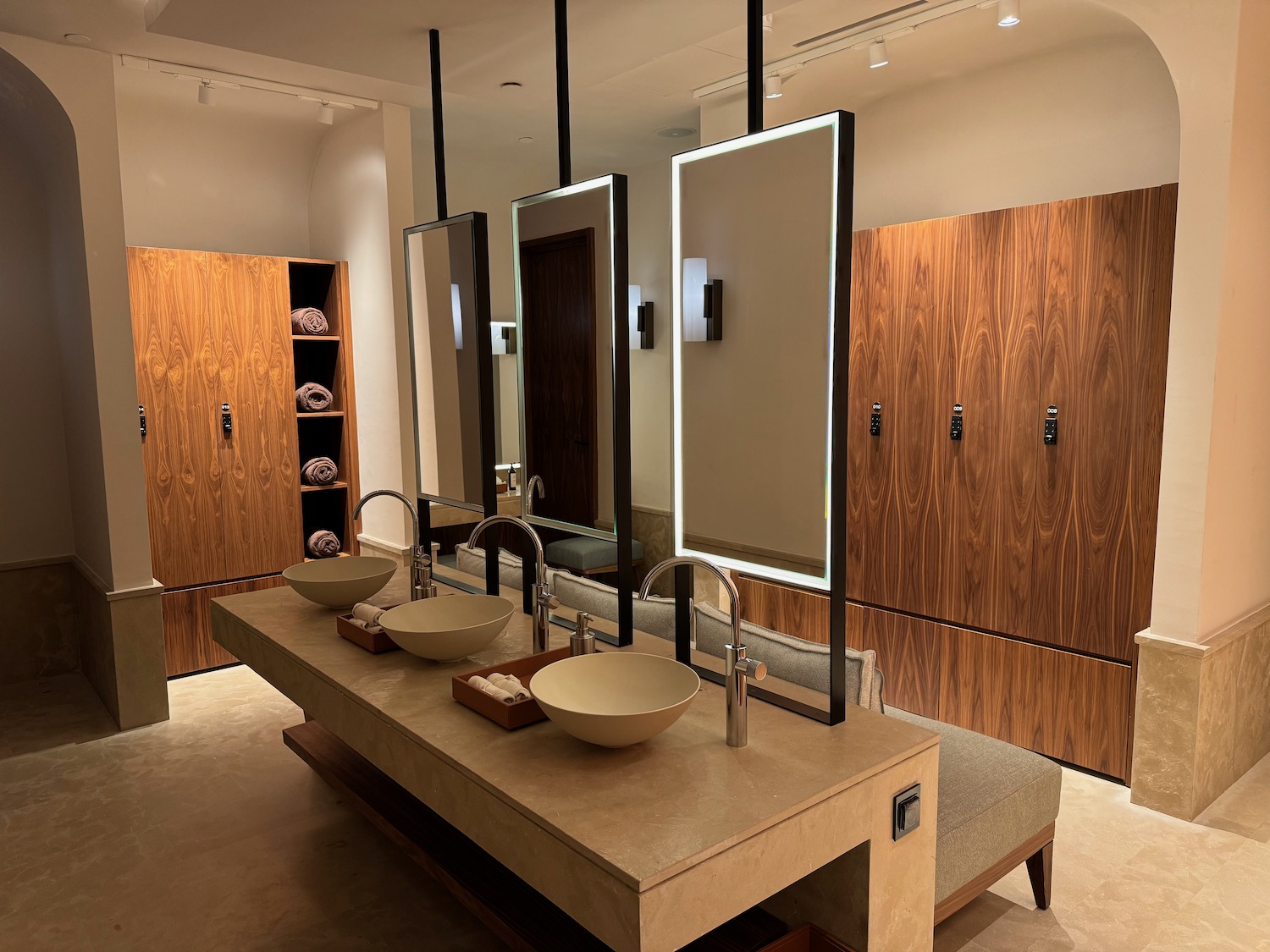 a bathroom with sinks and mirrors