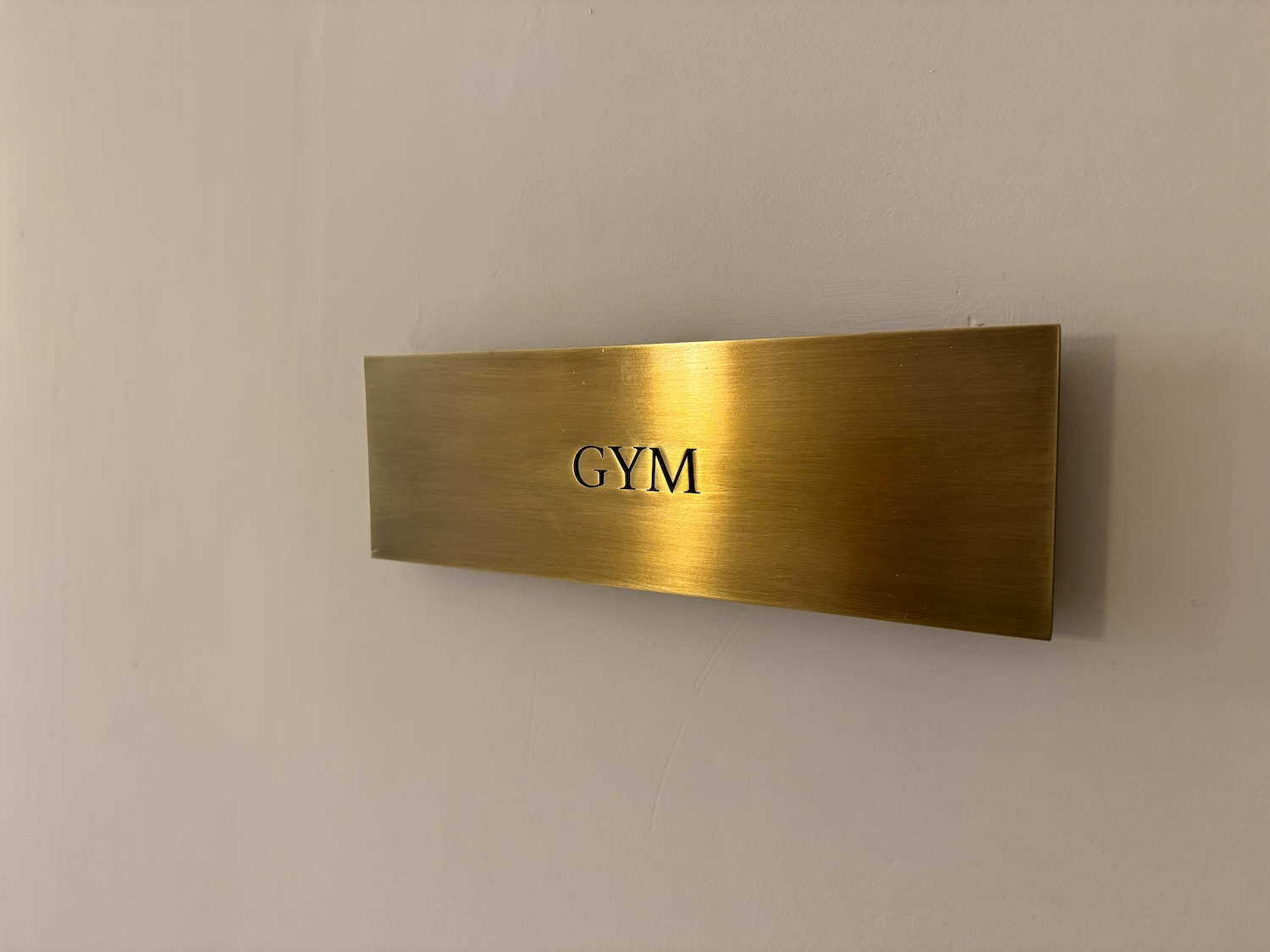 a gold sign on a wall