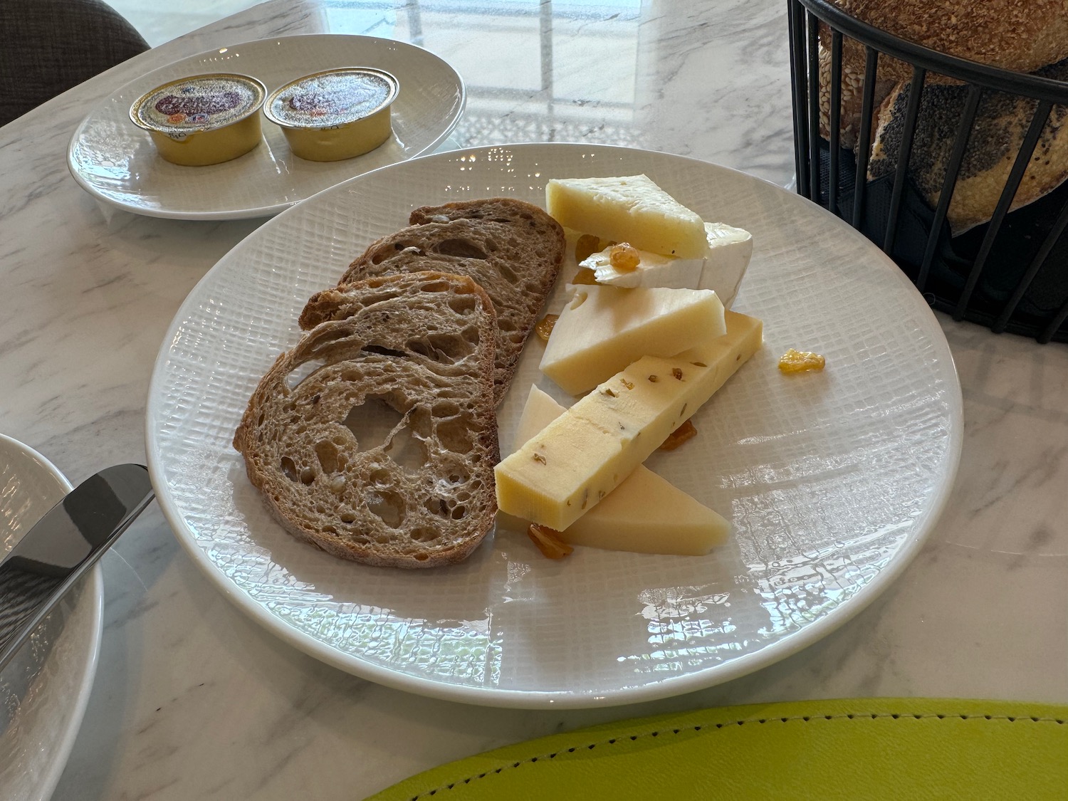 a plate of cheese and bread