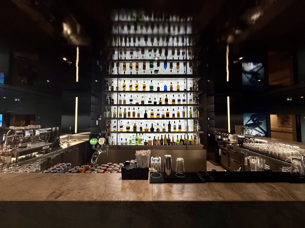 a bar with many bottles of alcohol