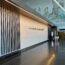 a large lobby with a wall and a mural on the wall