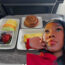 Black Woman First Class Meal American Airlines