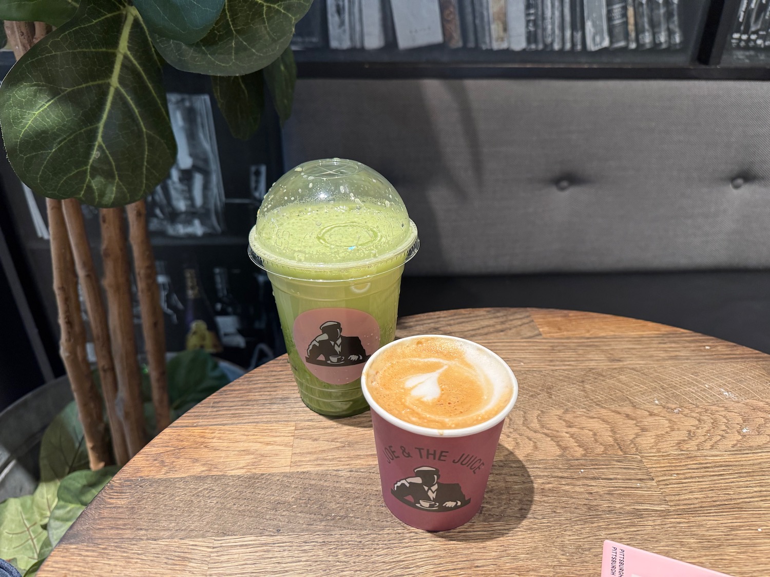 two cups of green liquid on a table