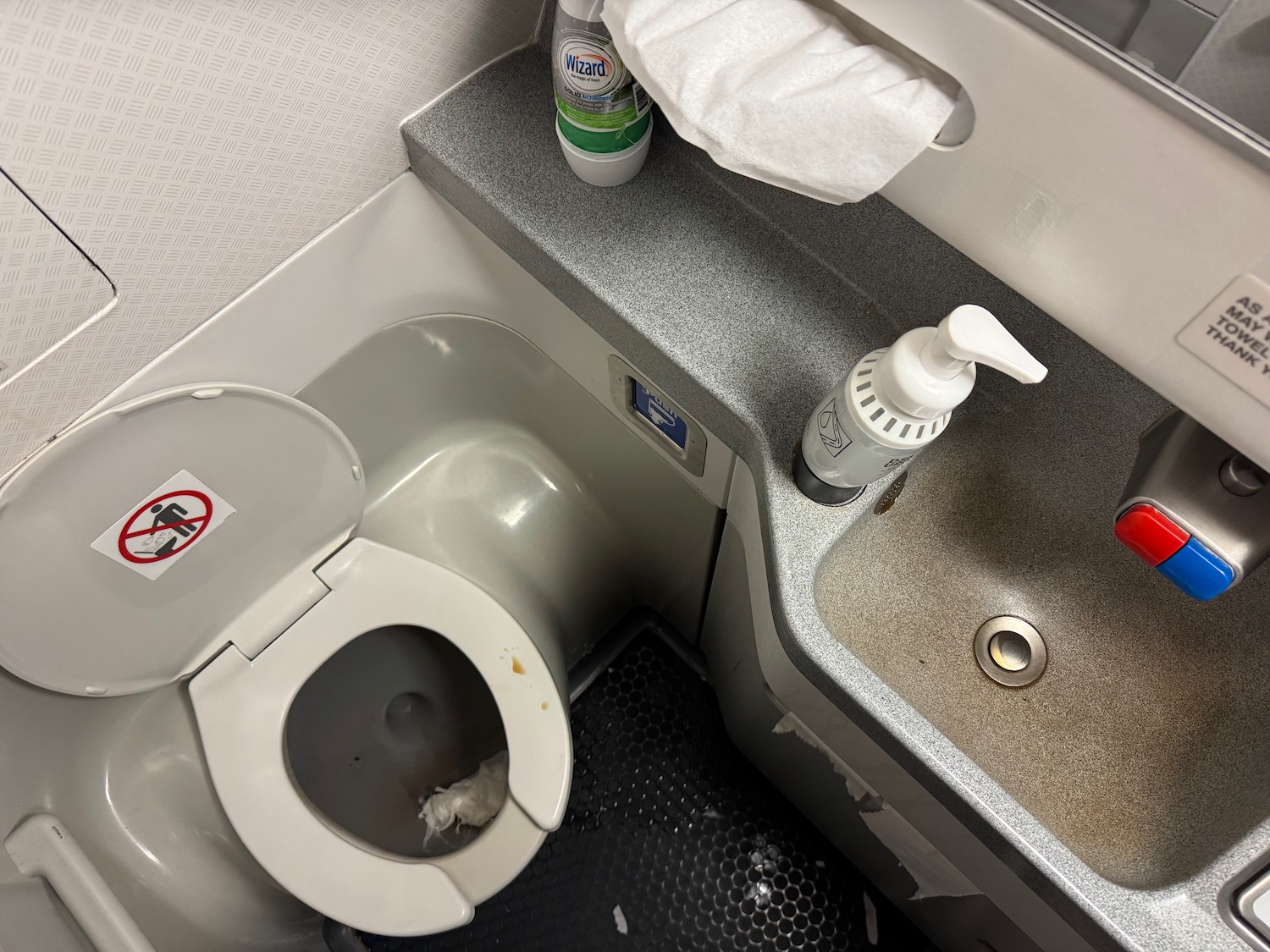a toilet and sink in a bathroom