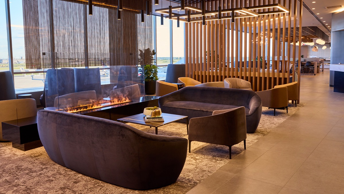 a room with couches and a fire