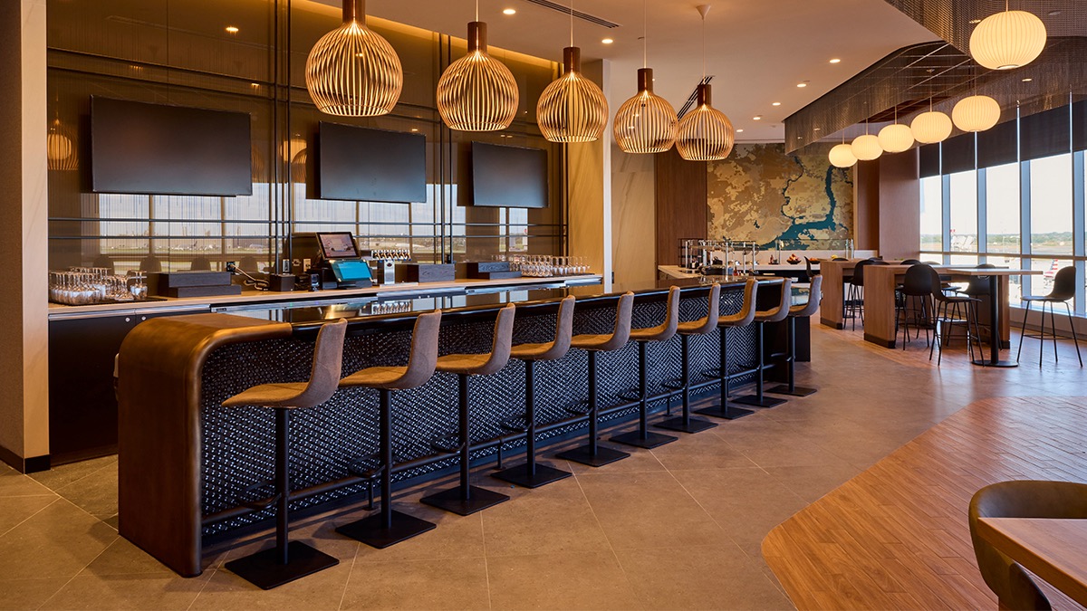a bar with chairs and a counter