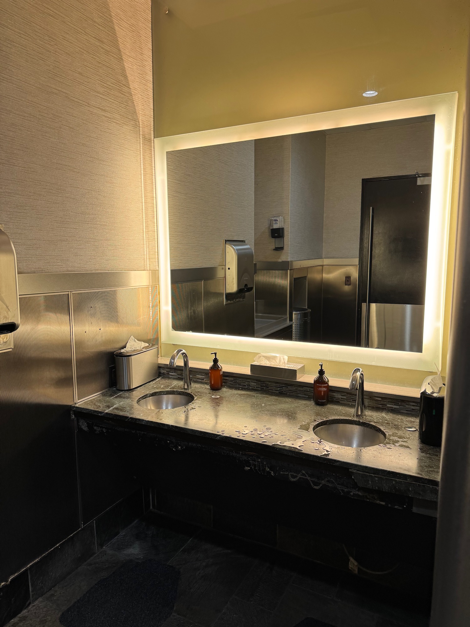 a bathroom with a mirror and sink