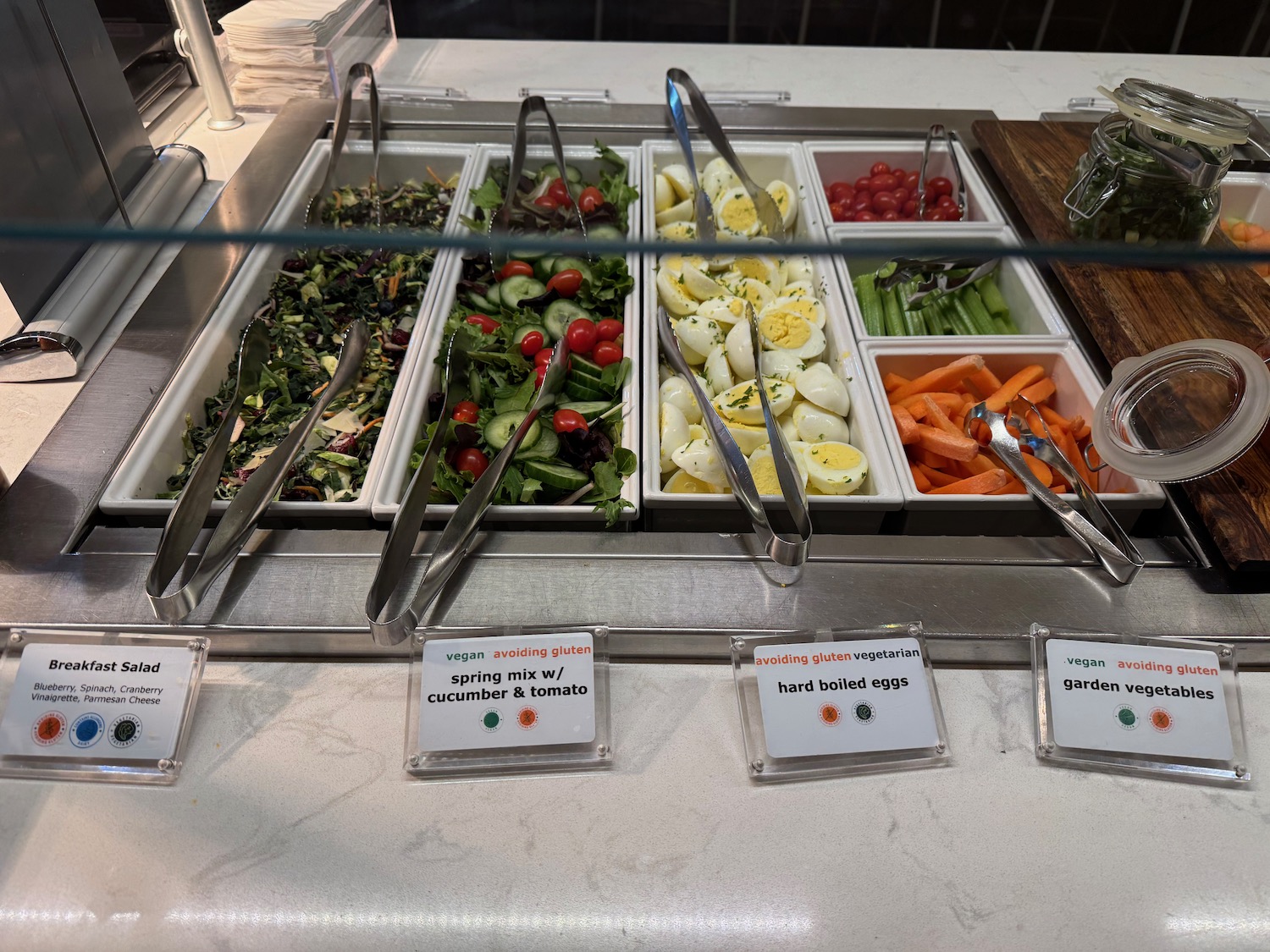 a salad bar with different types of vegetables