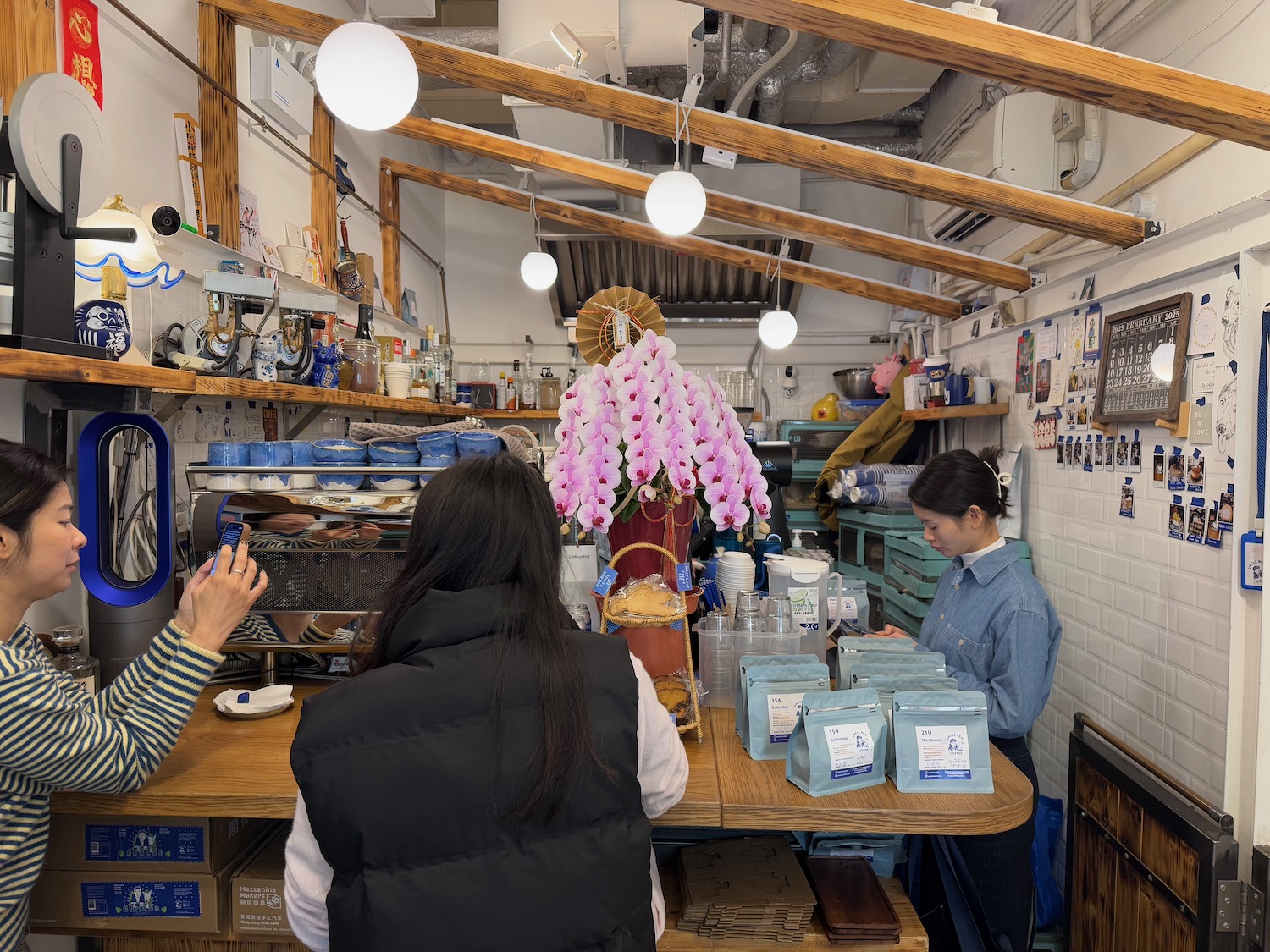 a group of people at a counter in a restaurant