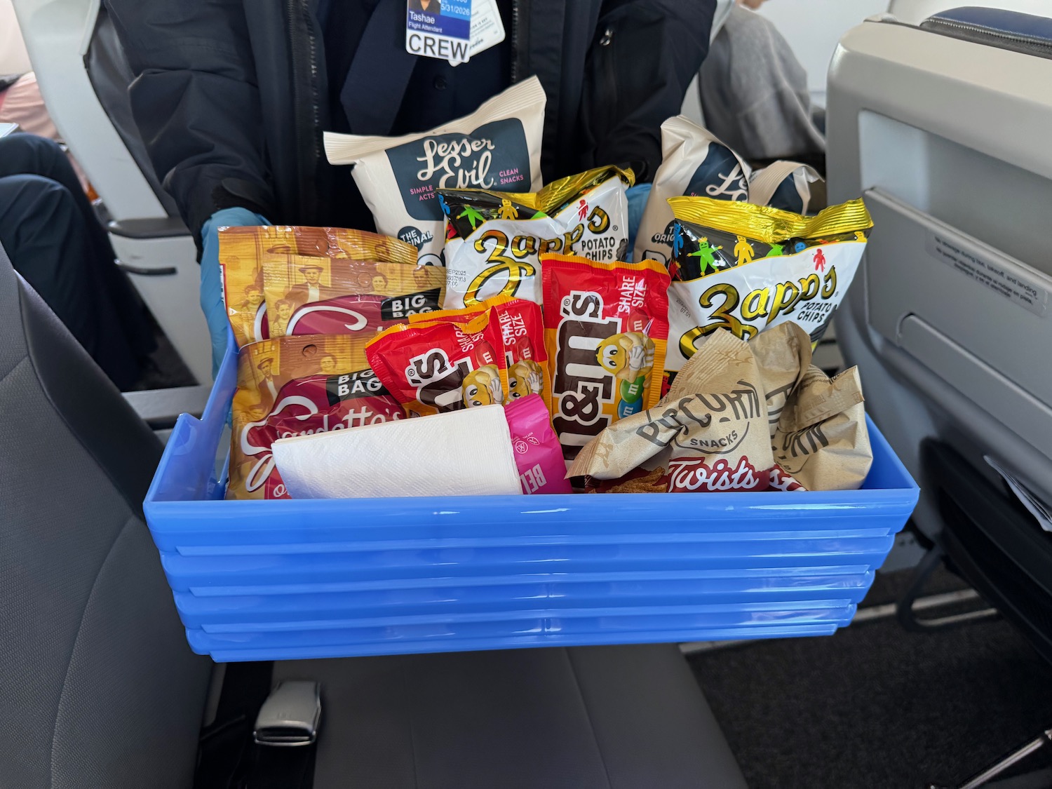 a blue basket of snacks