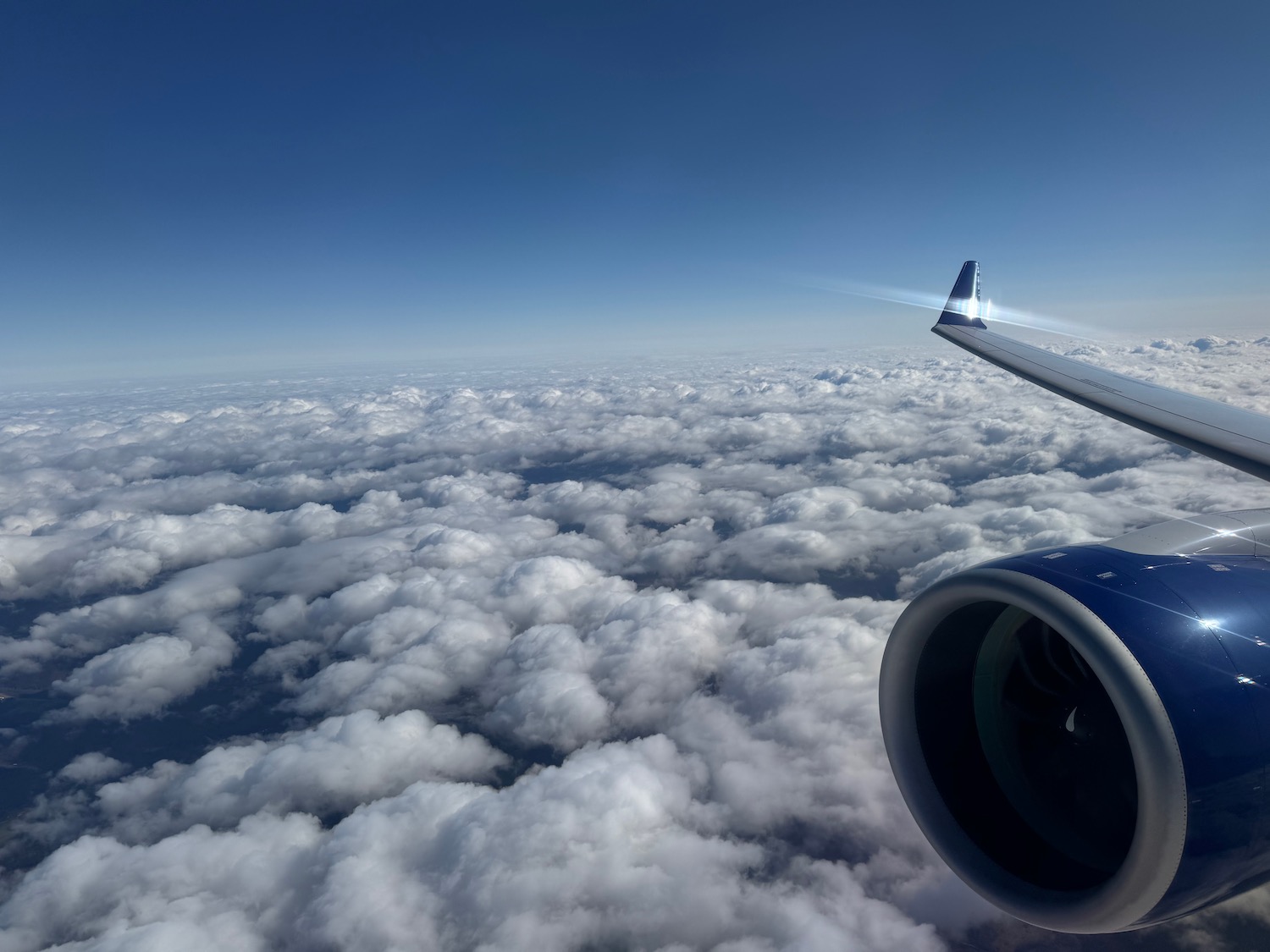 an airplane wing and the sky