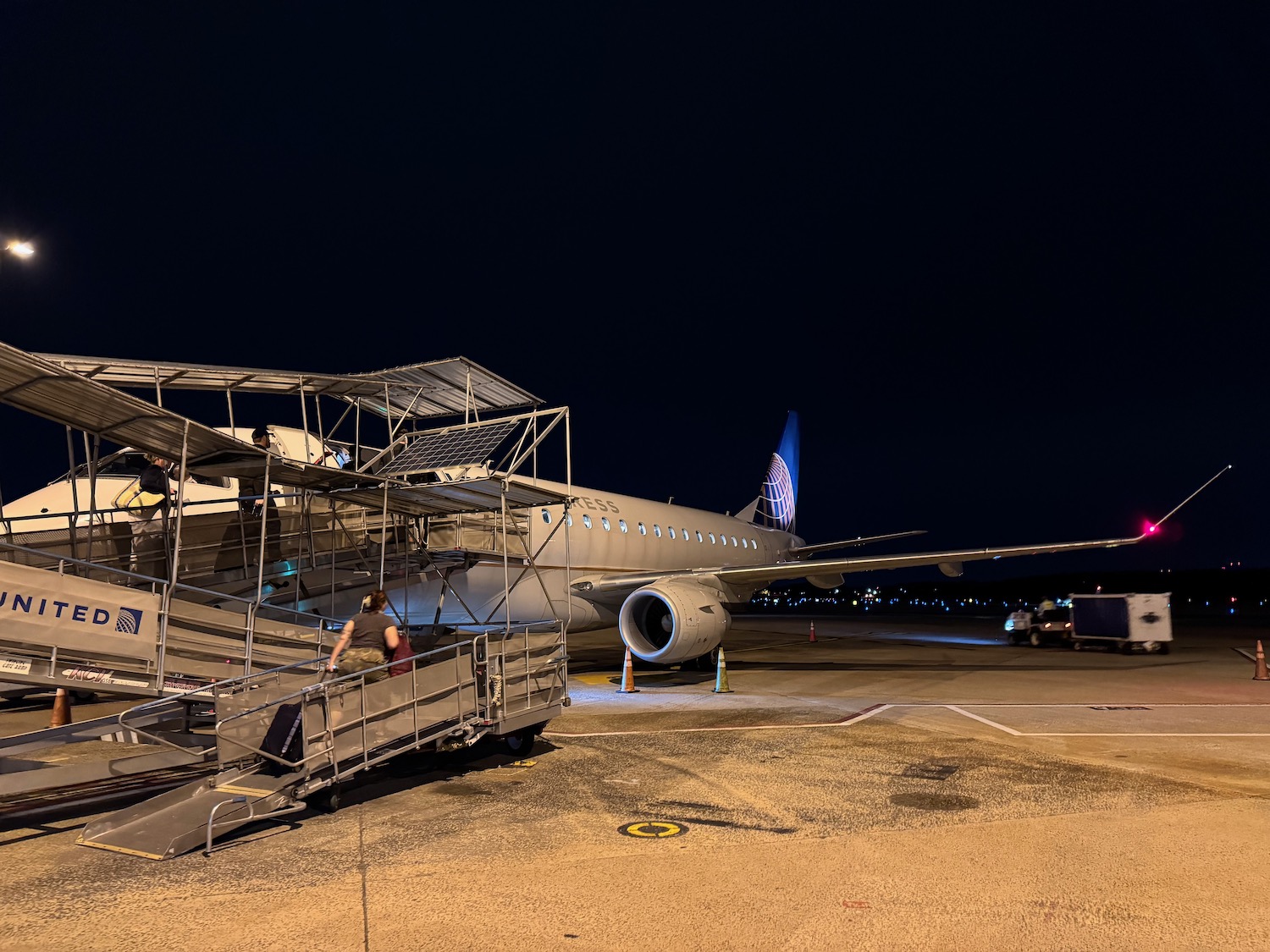 a plane on the tarmac at night