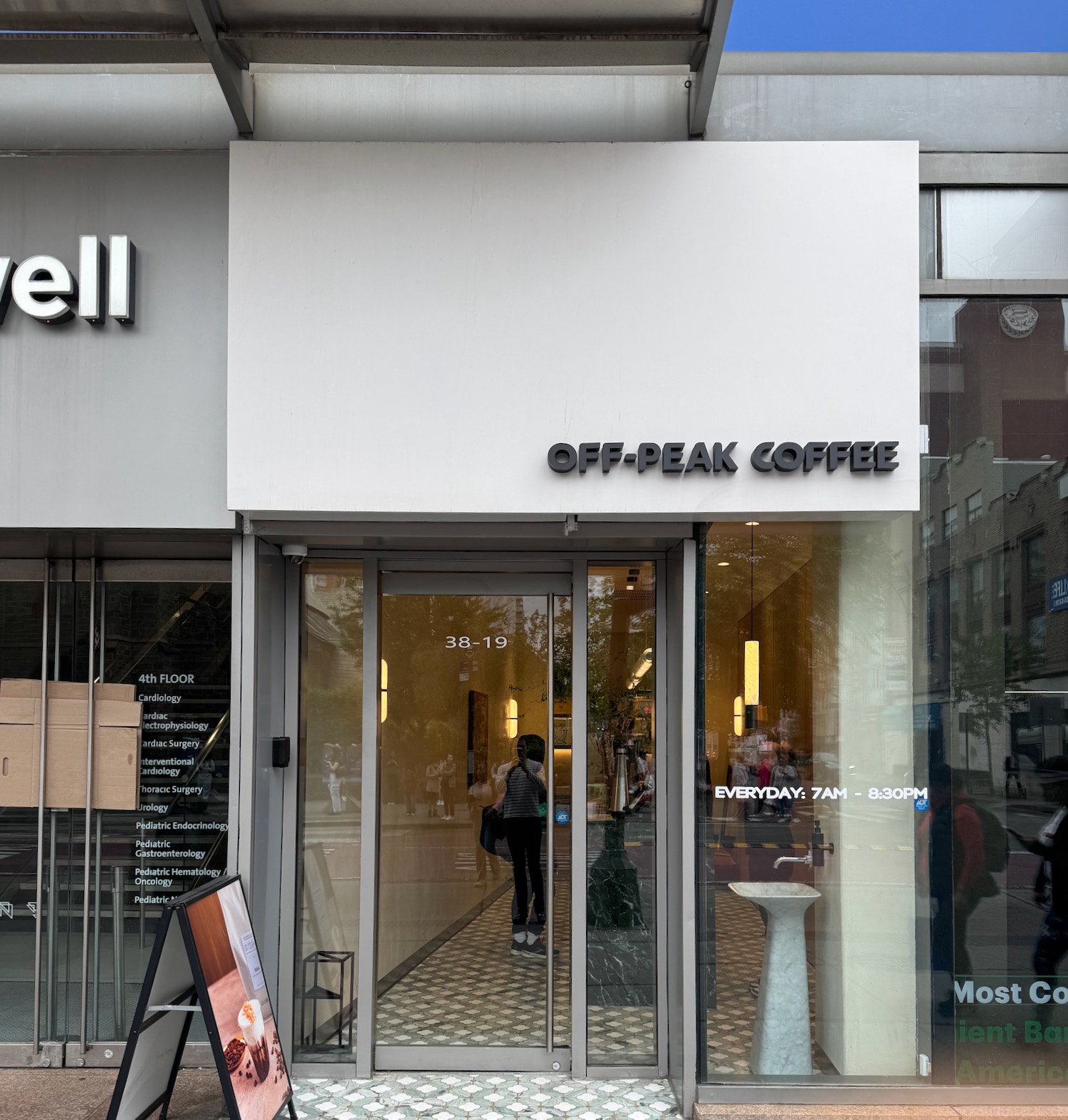 a store front with a sign