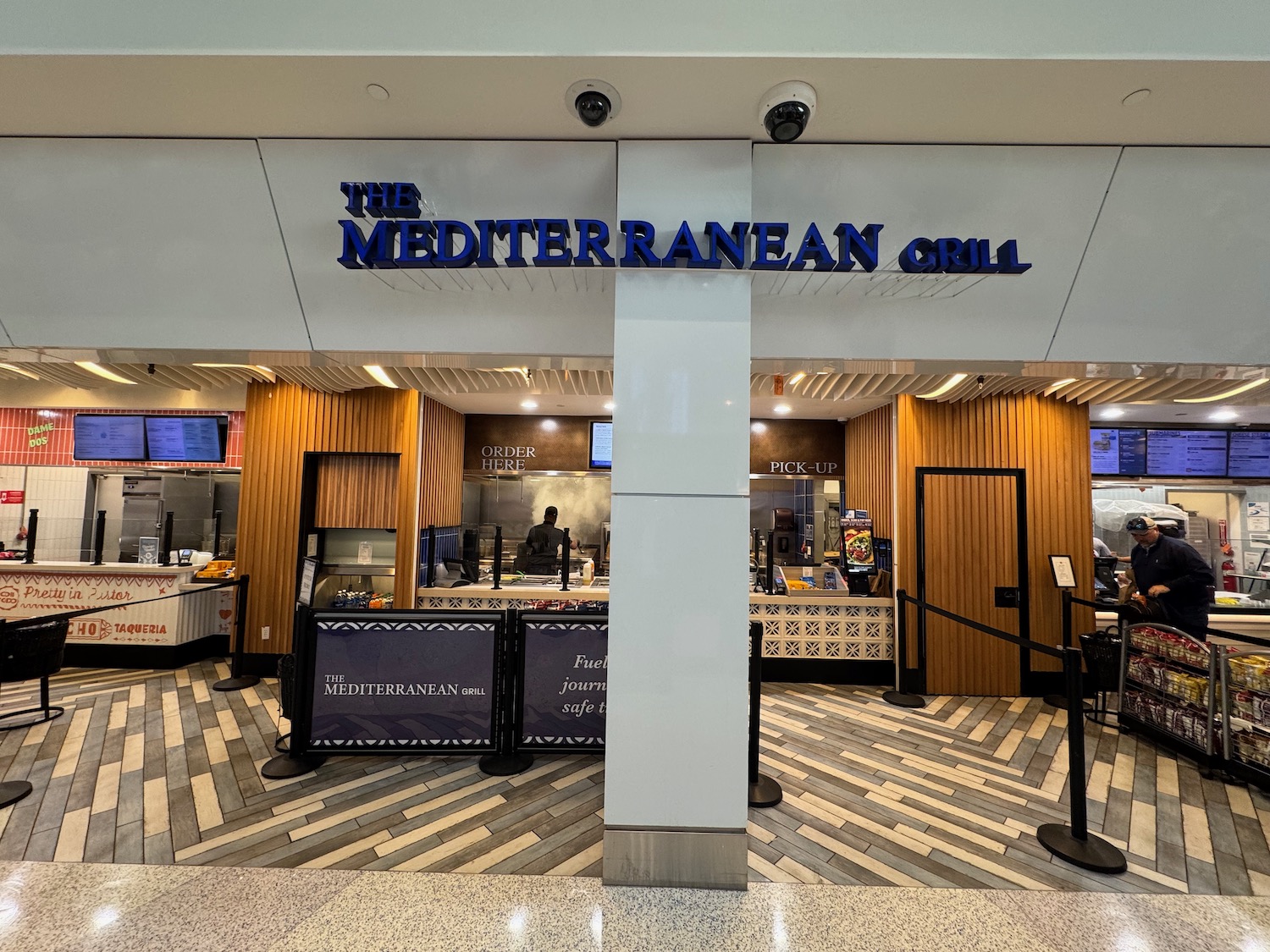 a restaurant with a large white column