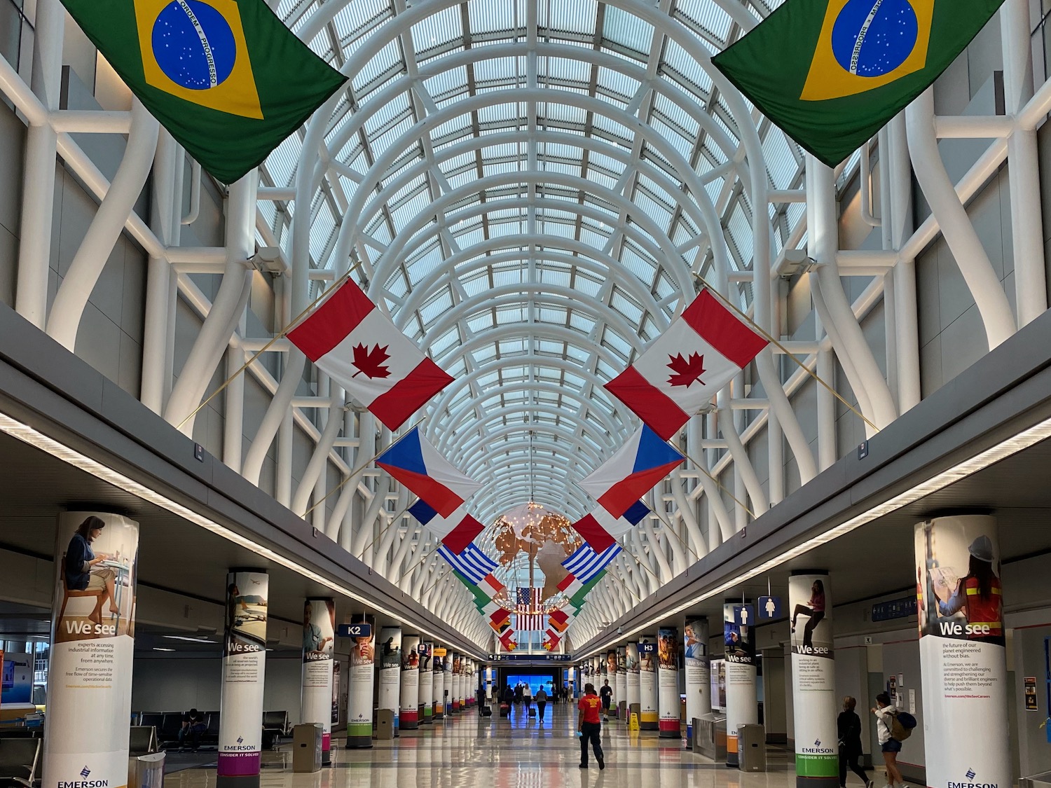 a hallway with flags from the ceiling