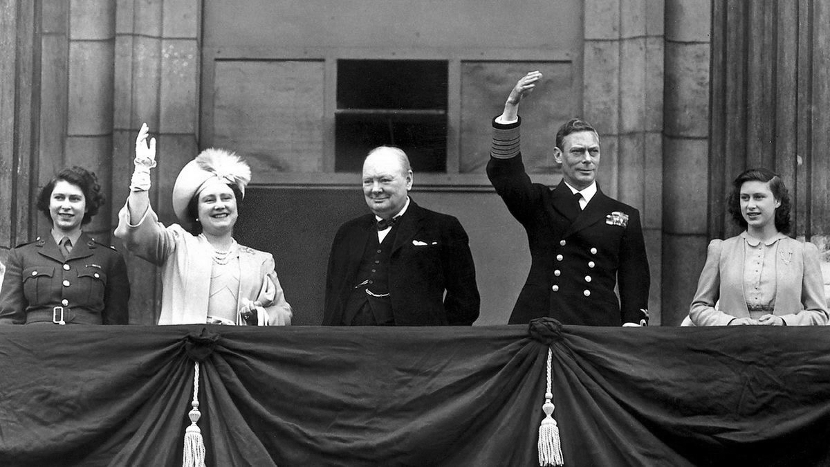 a group of people standing on a balcony