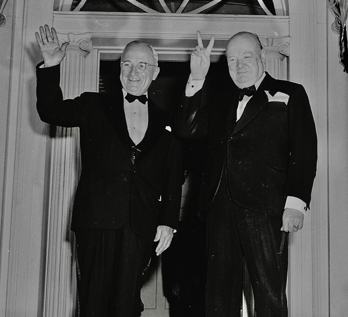 a couple of men in suits
