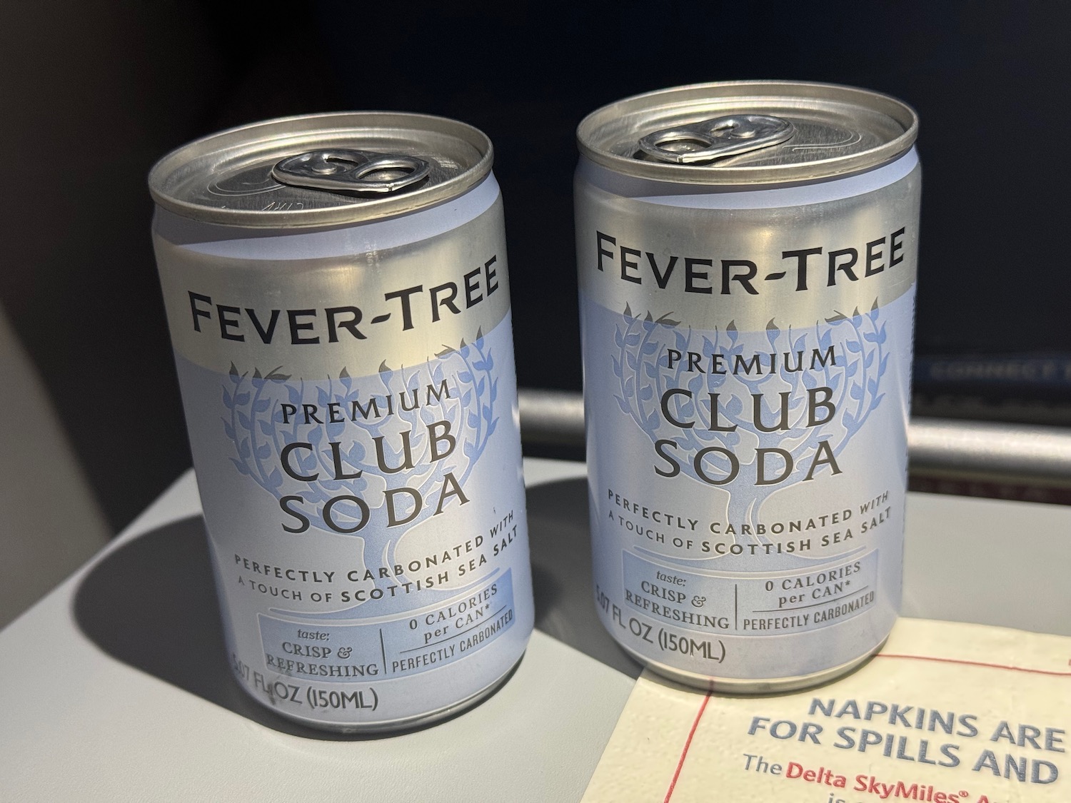 two cans of soda on a table