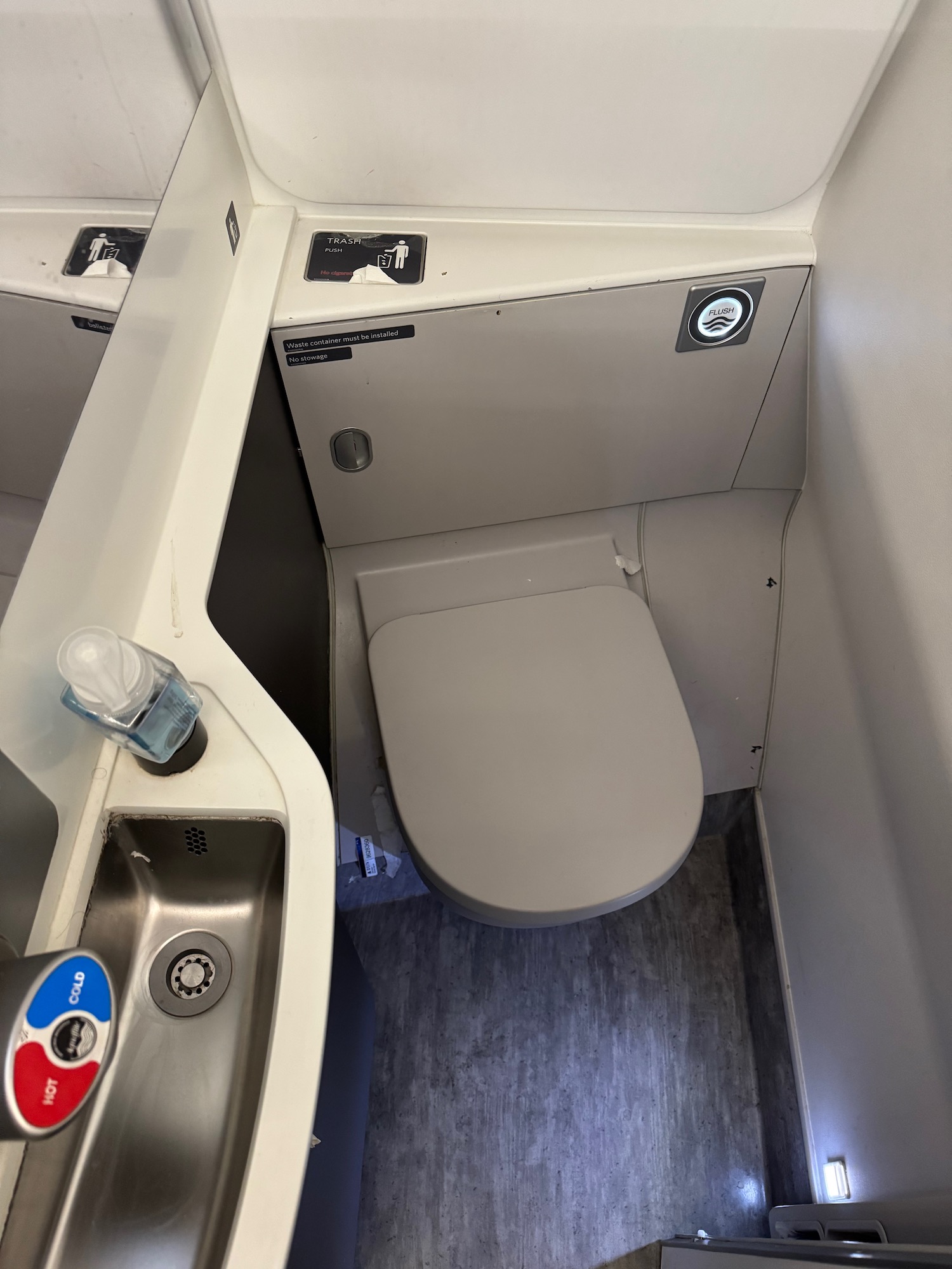 a toilet and sink in a bathroom