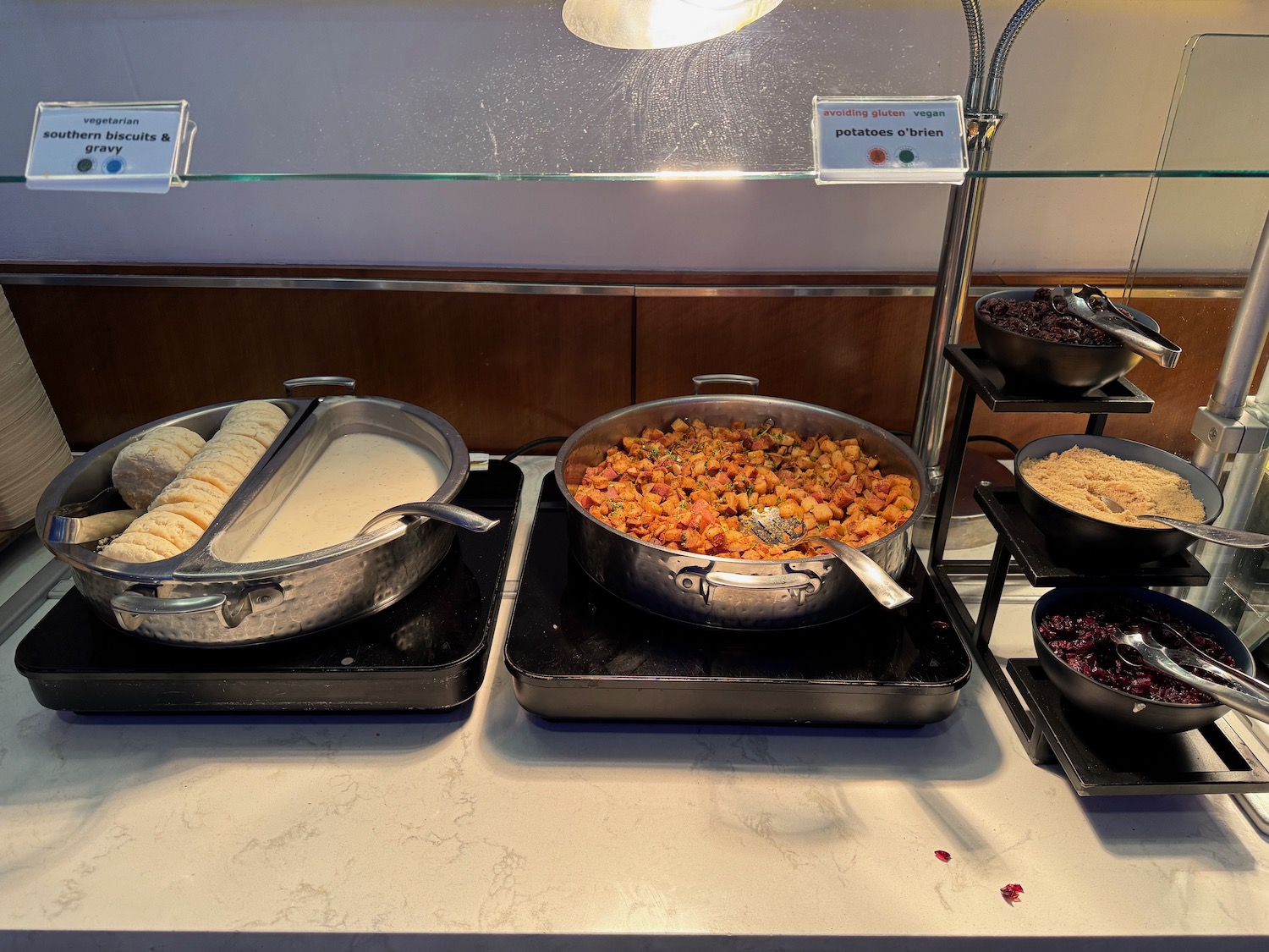 food on a counter with a glass shelf