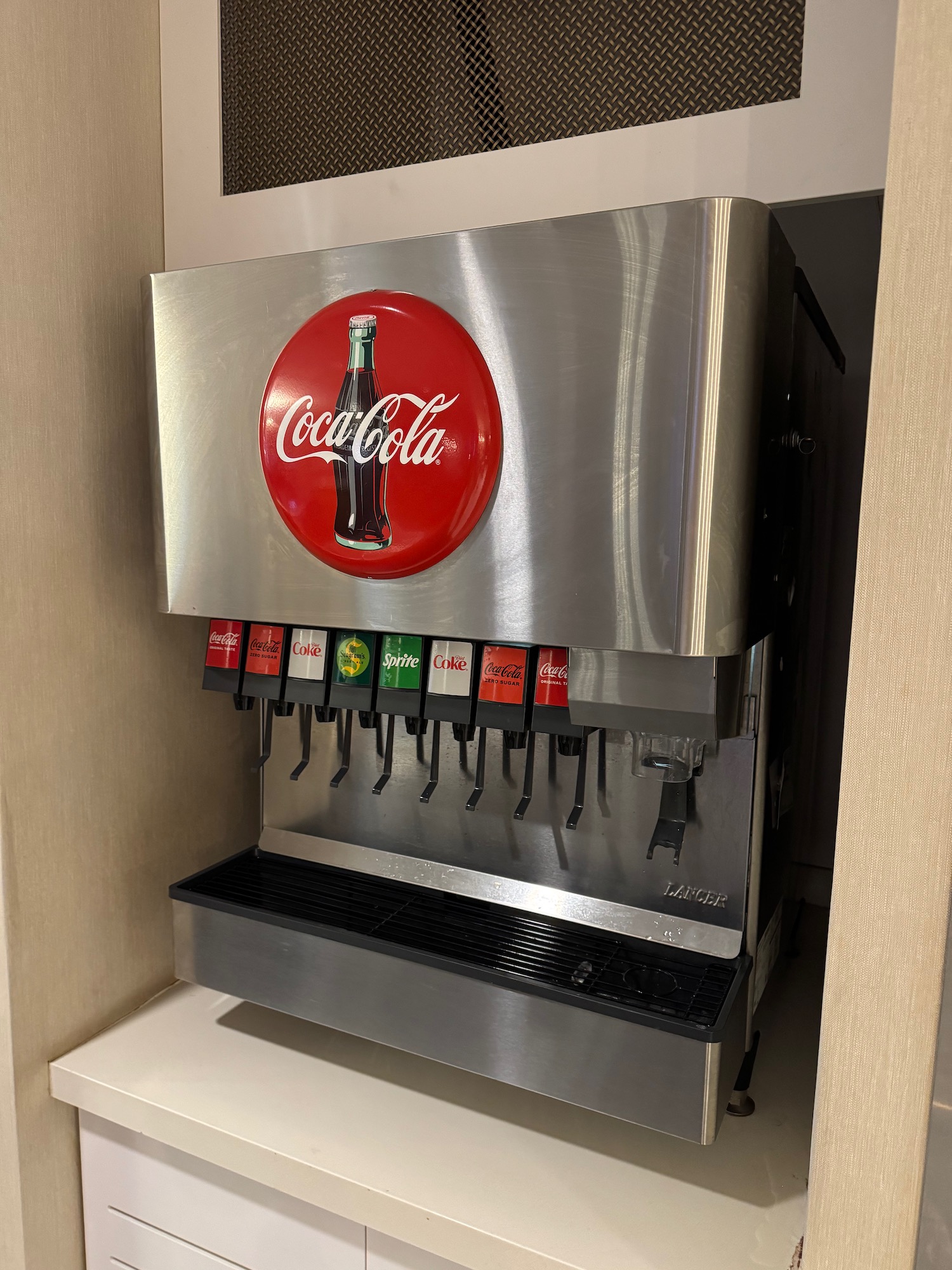 a soda machine with a logo on it