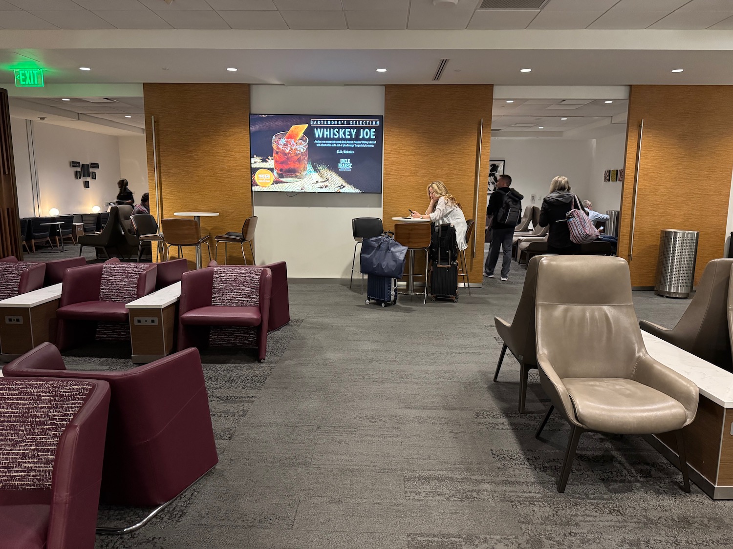a group of people in a lounge area