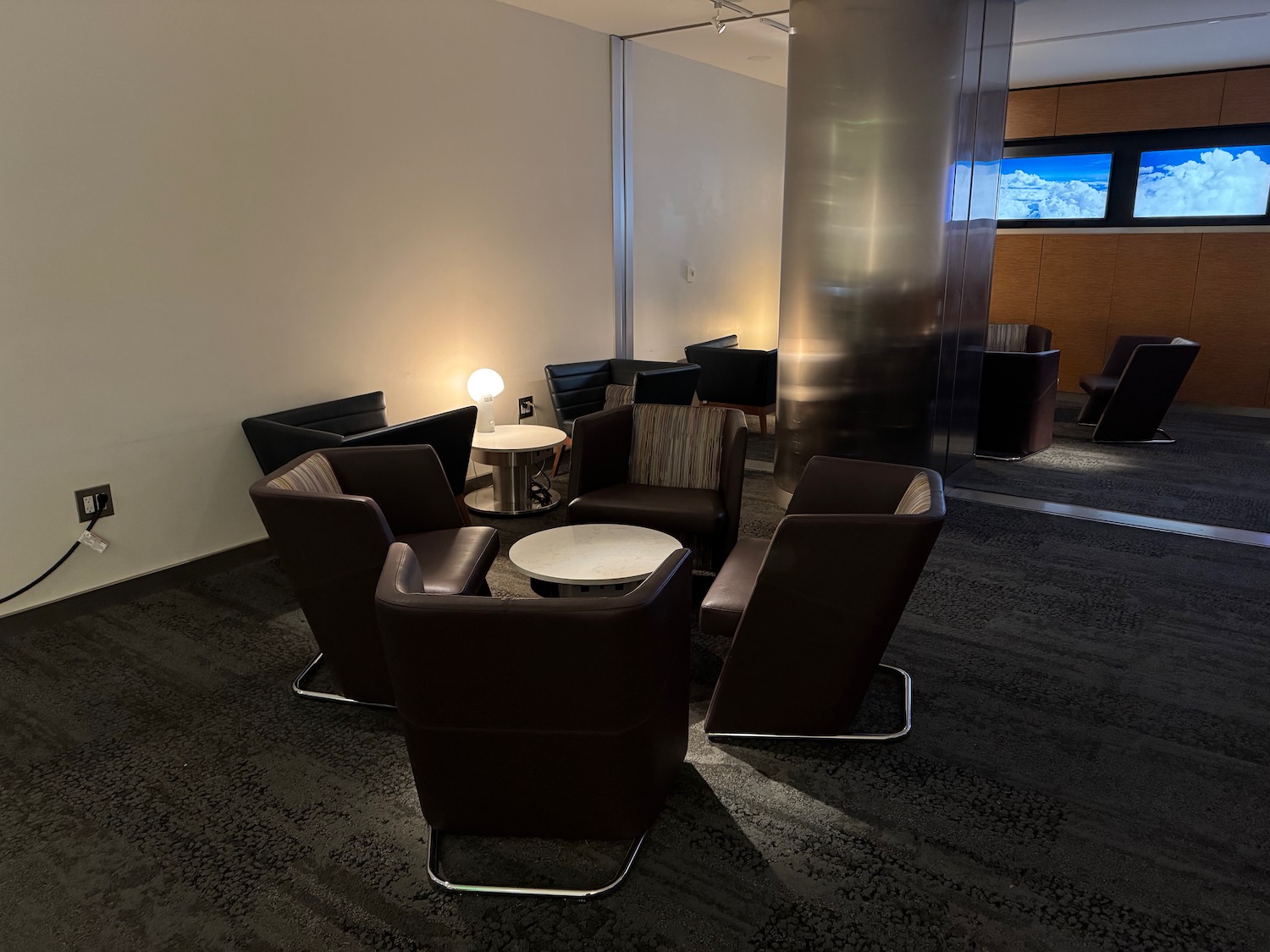 a group of chairs and a table in a room