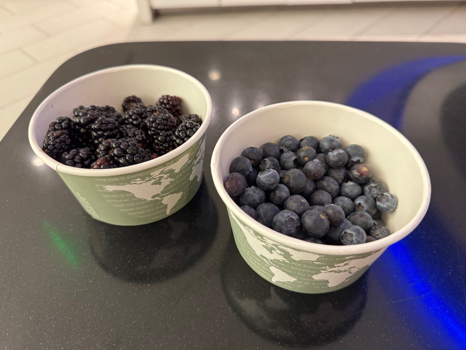 two bowls of blueberries and blackberries