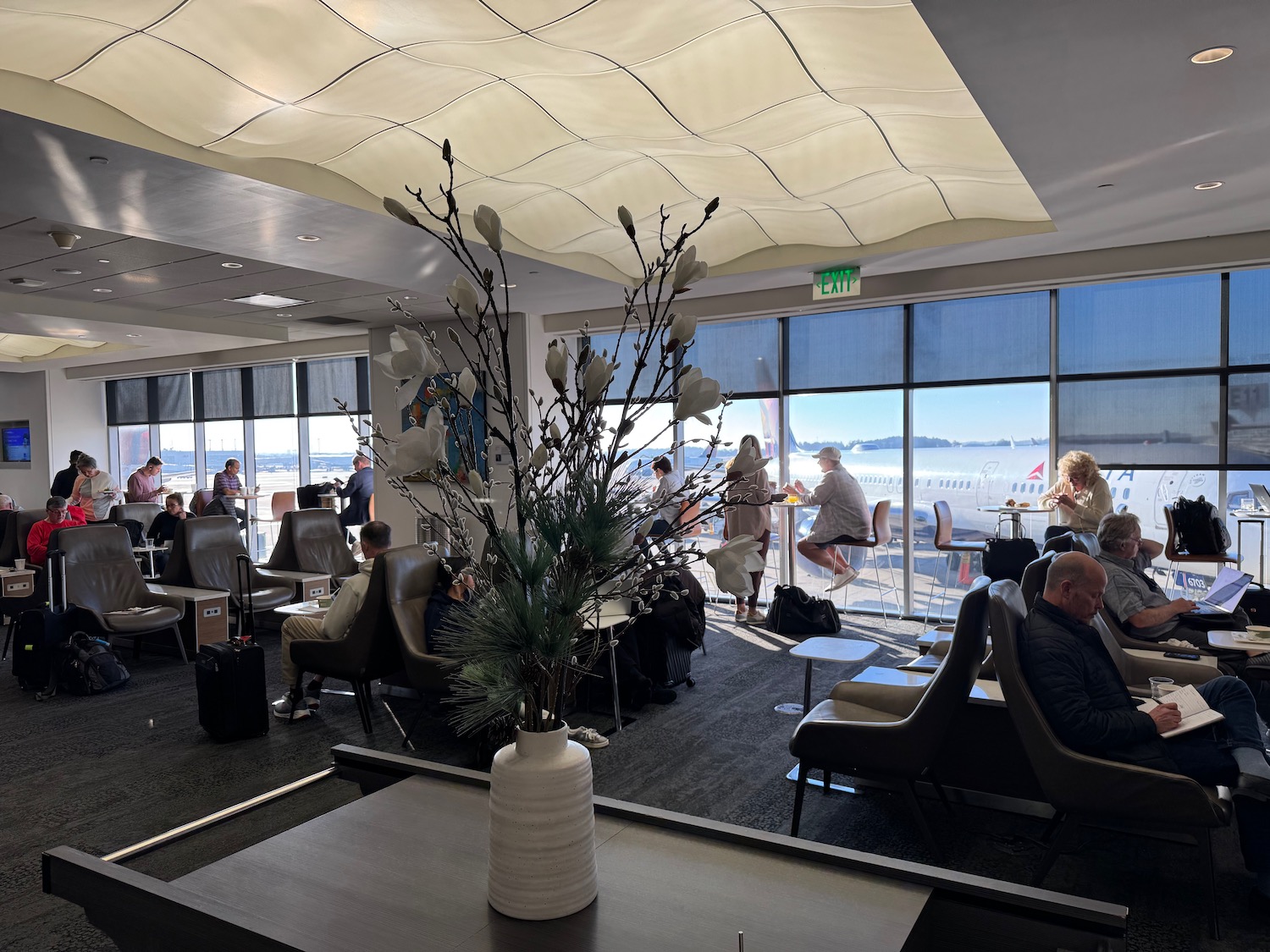 a group of people in an airport lounge