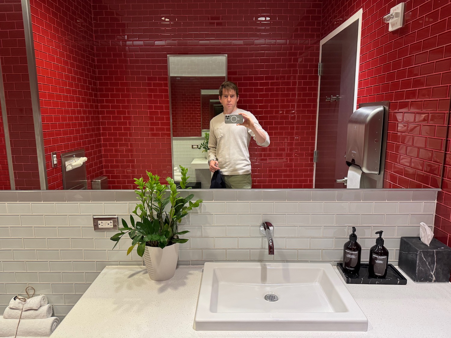 a man taking a selfie in a bathroom