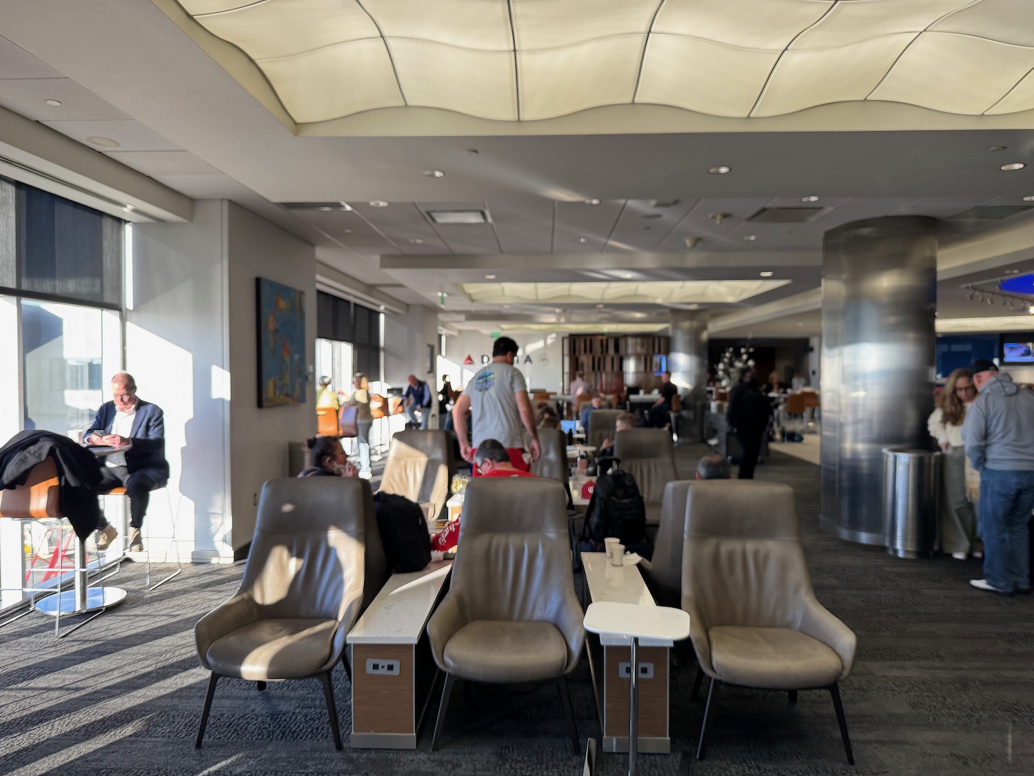 a group of people in an airport lounge