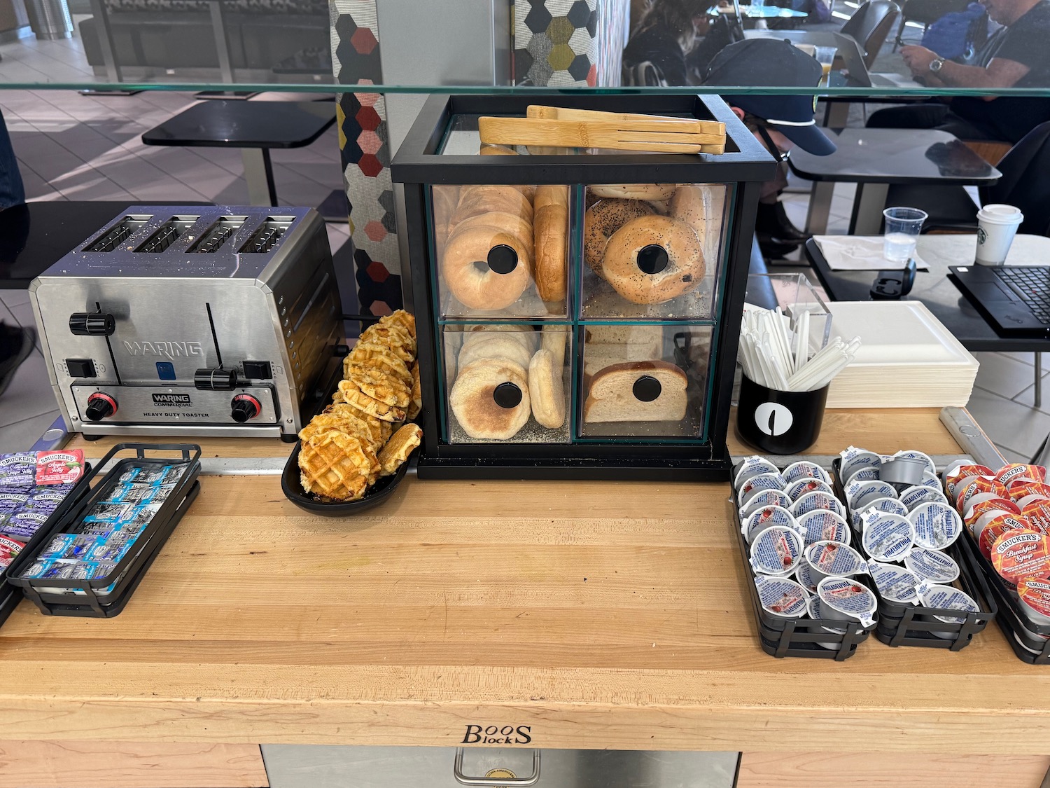 a display case of bagels and waffles
