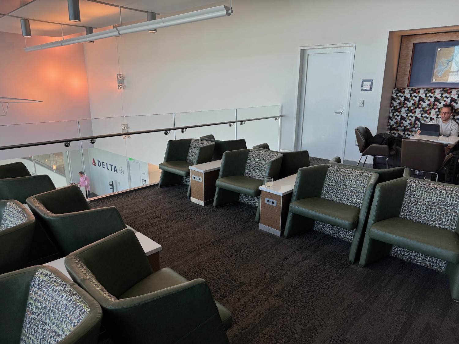 a room with chairs and a railing